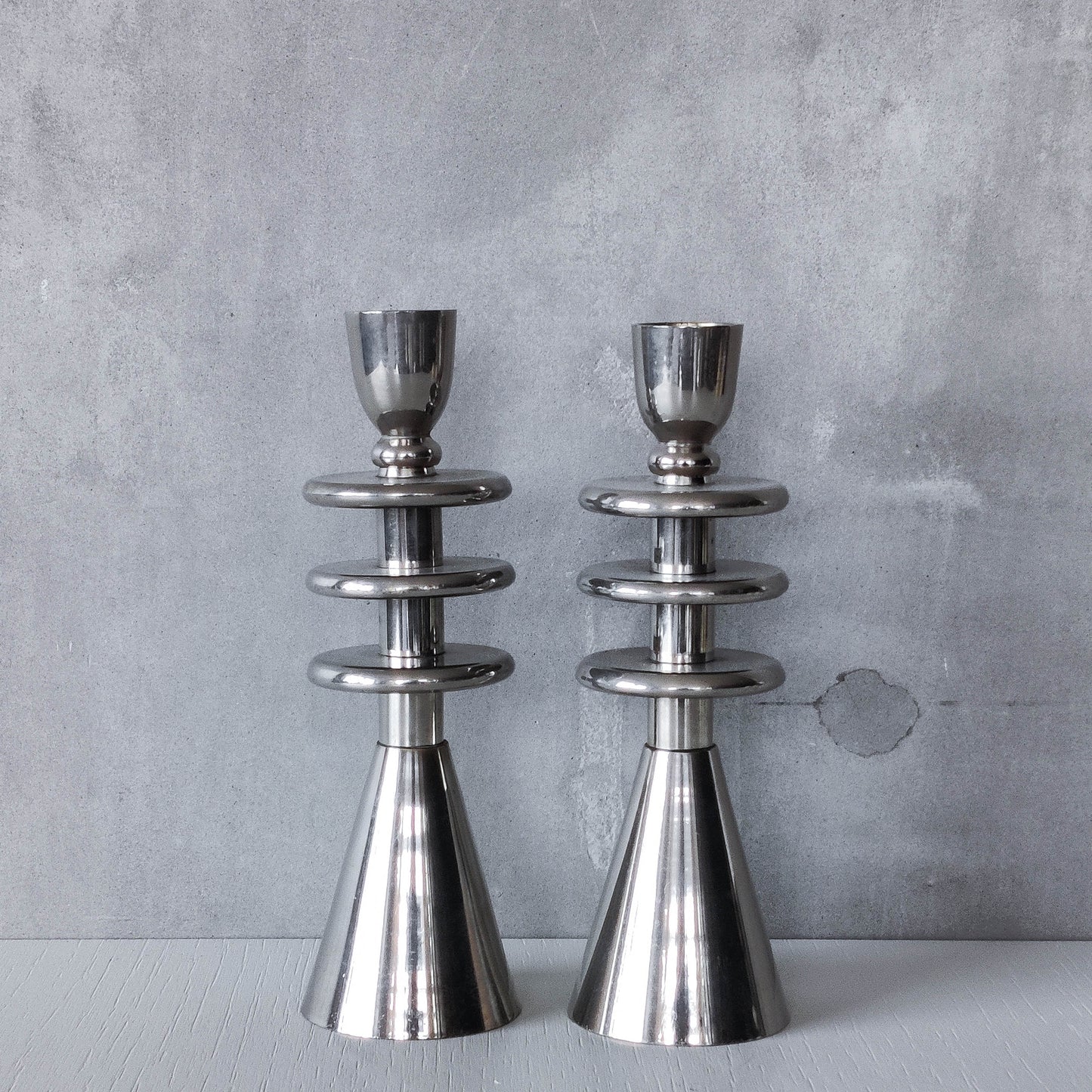 Vintage pair of chrome modernist form sculptural tiered candle holders