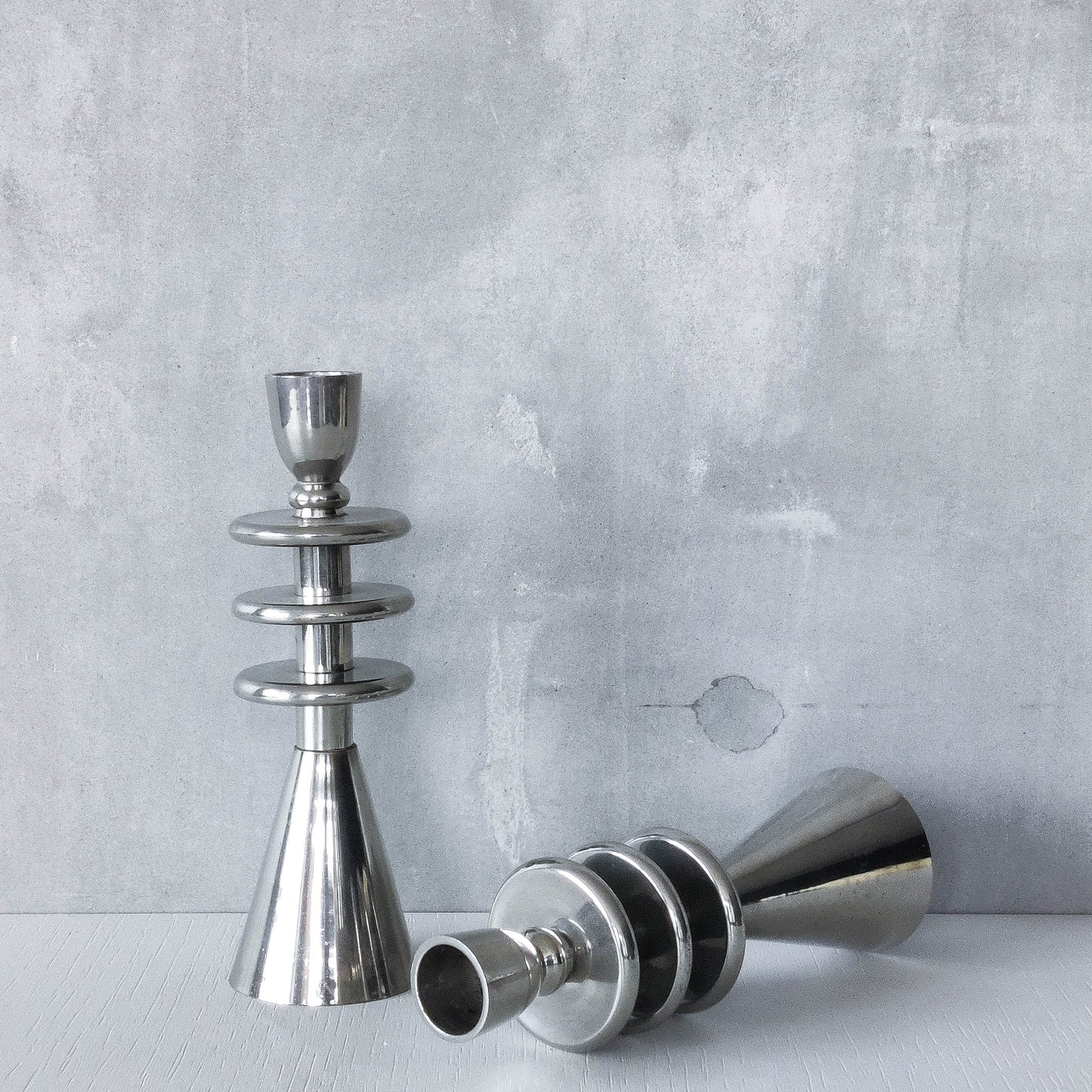 Vintage pair of chrome modernist form sculptural tiered candle holders