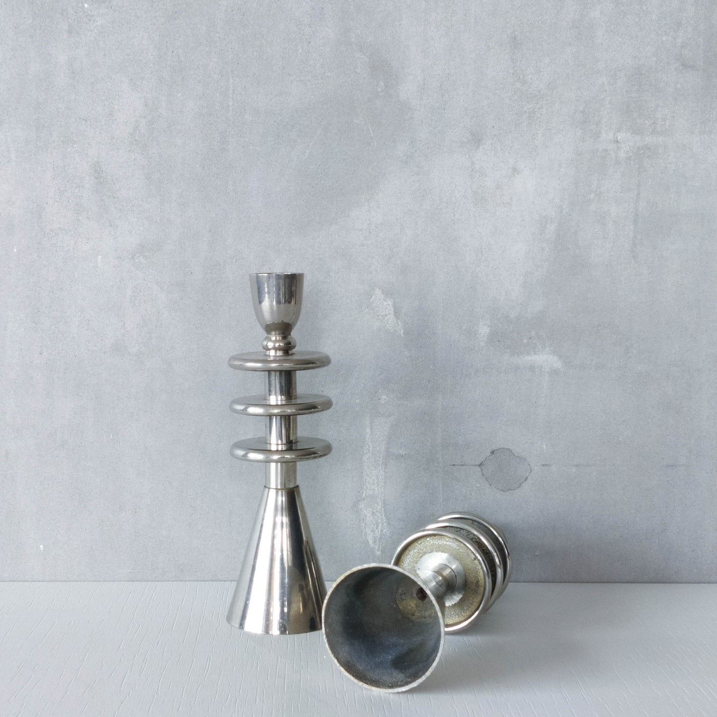 Vintage pair of chrome modernist form sculptural tiered candle holders