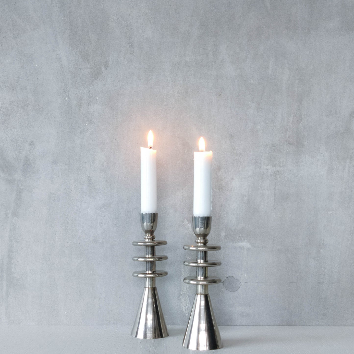 Vintage pair of chrome modernist form sculptural tiered candle holders