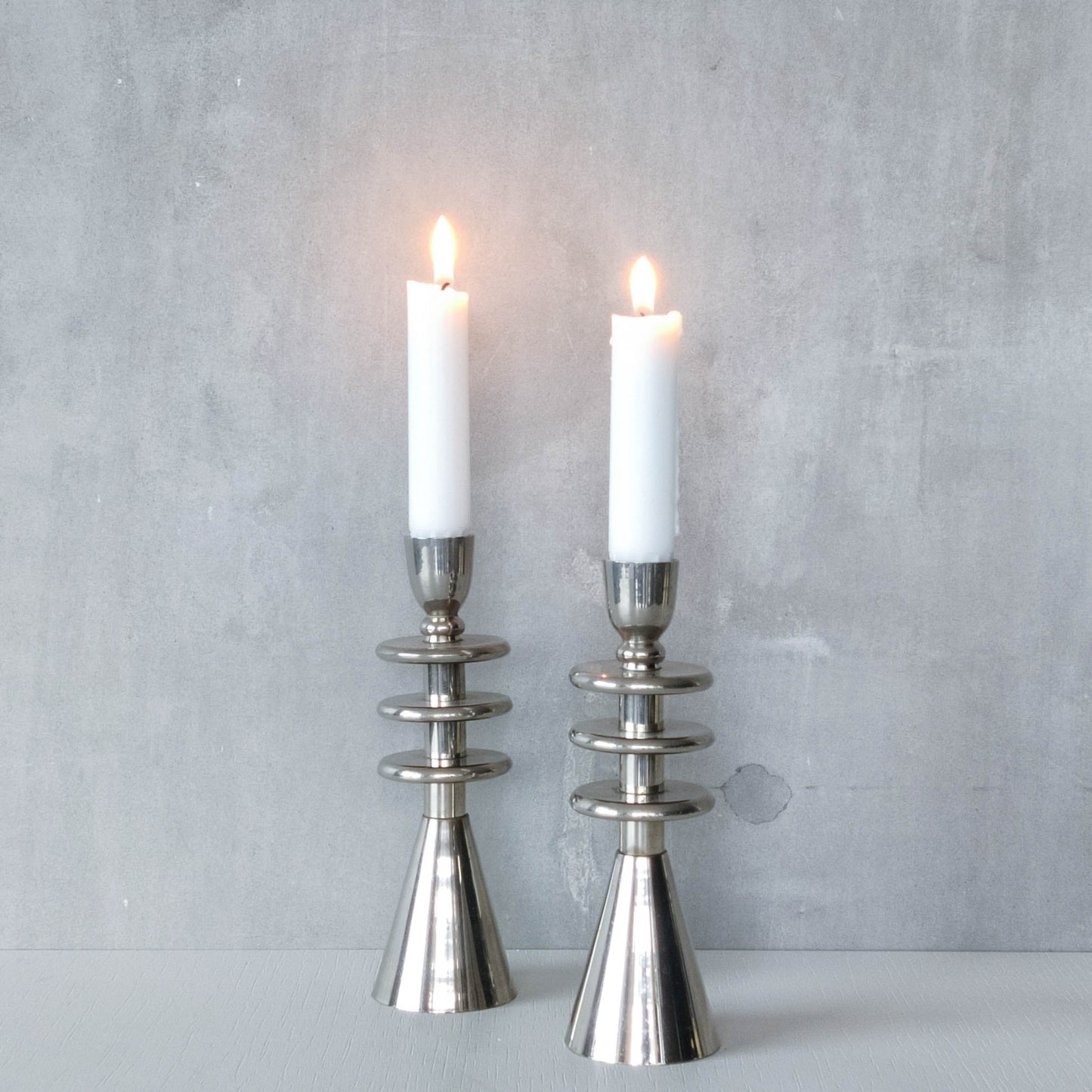 Vintage pair of chrome modernist form sculptural tiered candle holders