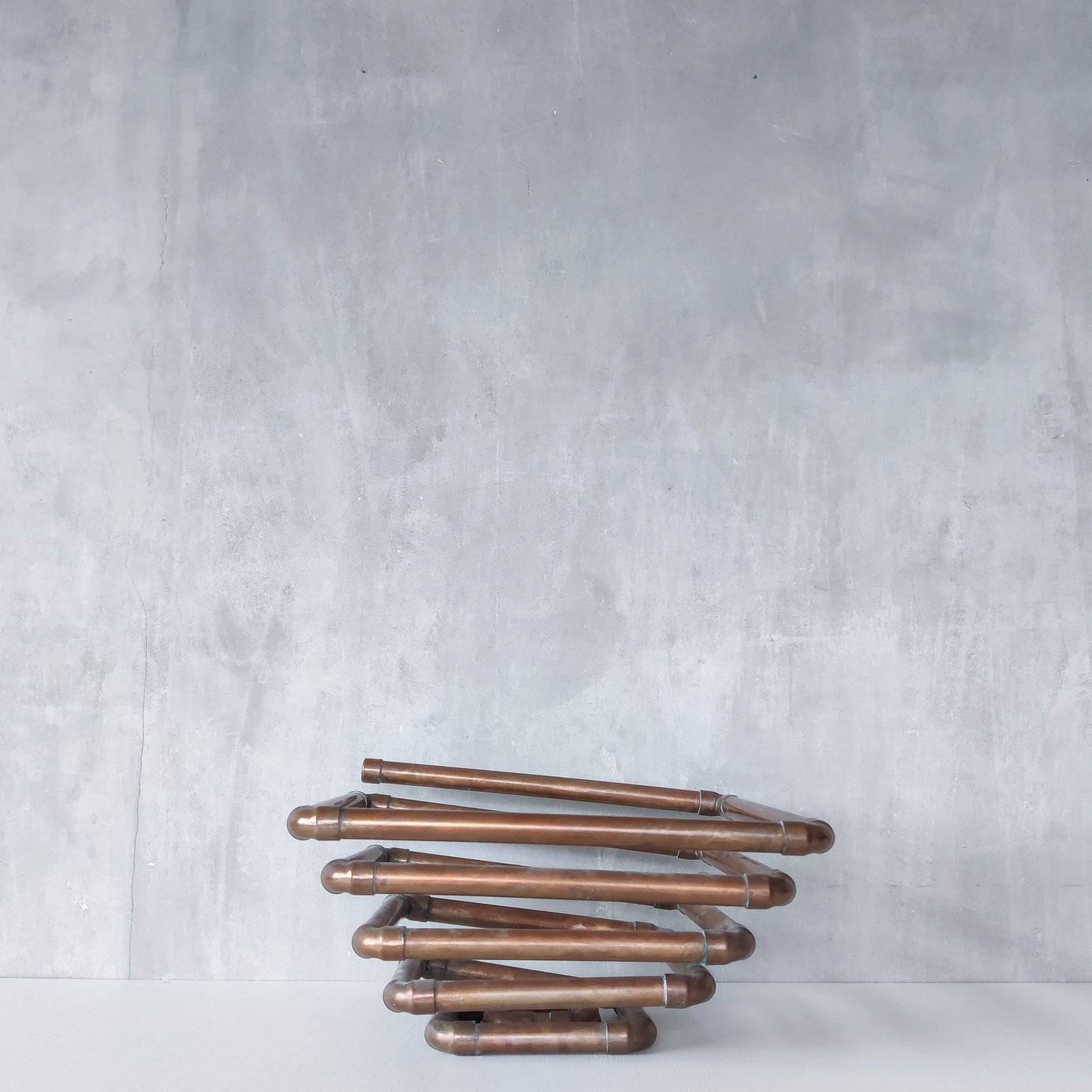 Artisan made sculptural spiral fruit bowl welded patinated copper pipe