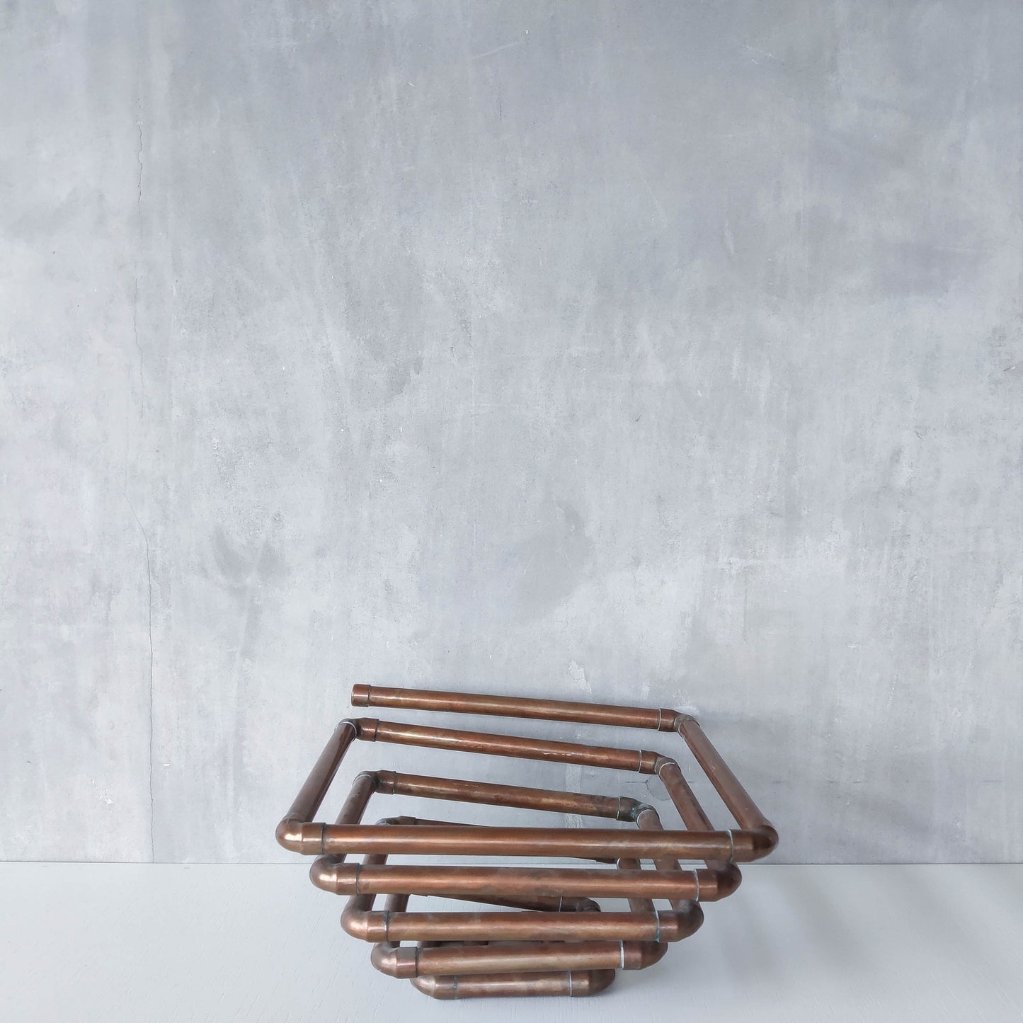 Artisan made sculptural spiral fruit bowl welded patinated copper pipe