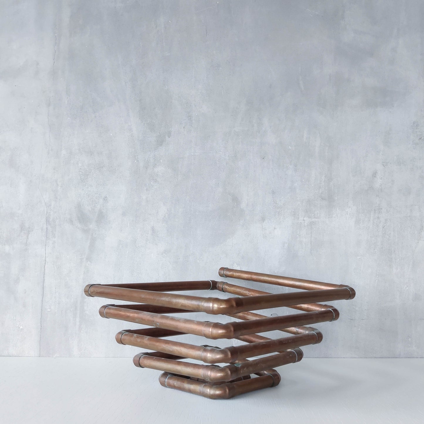 Artisan made sculptural spiral fruit bowl welded patinated copper pipe