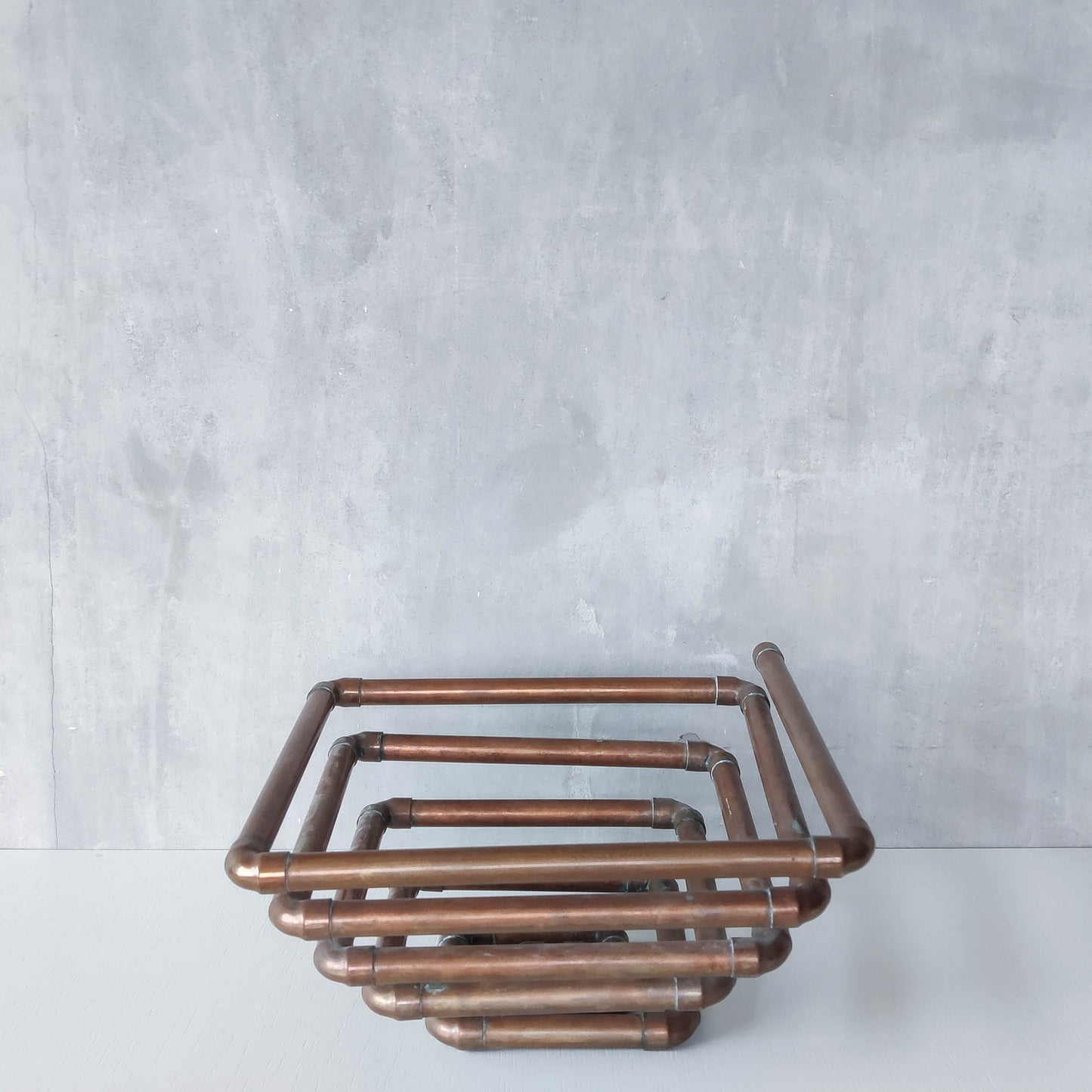 Artisan made sculptural spiral fruit bowl welded patinated copper pipe