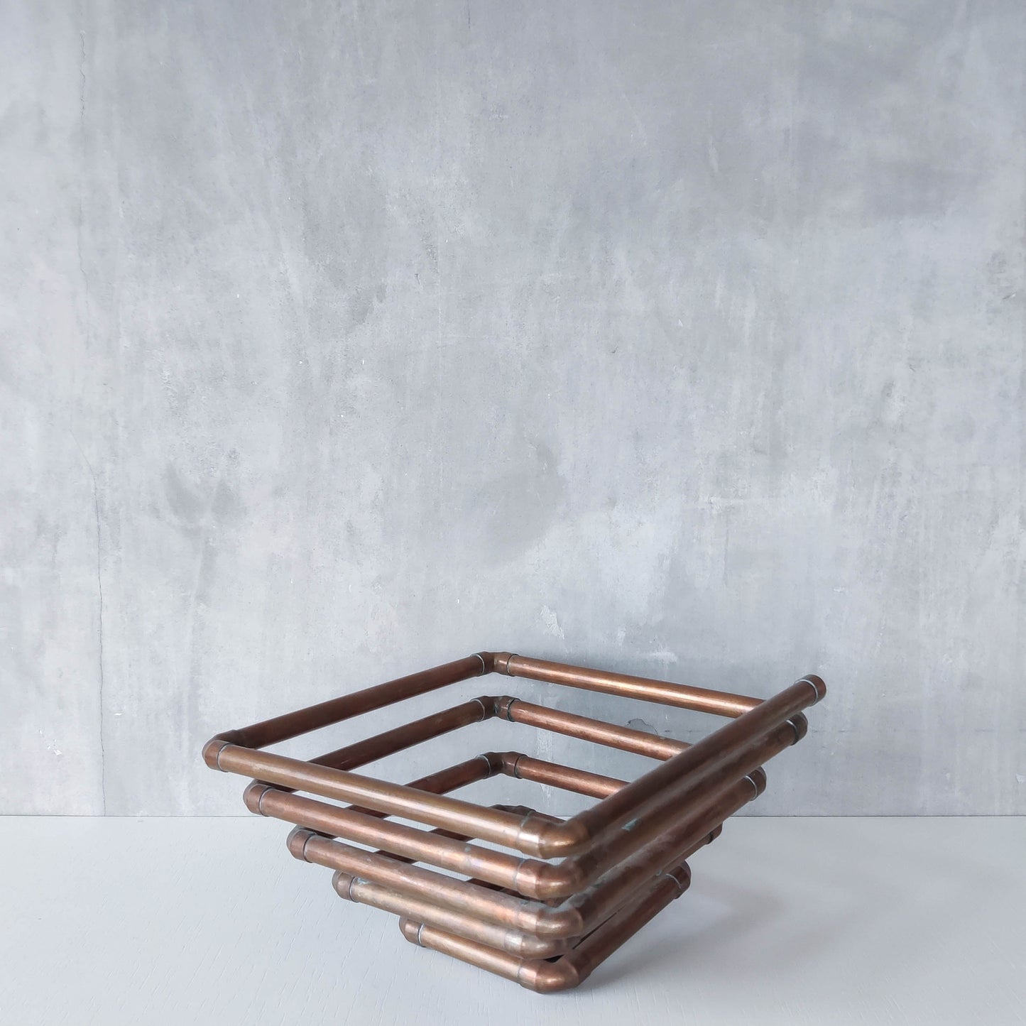 Artisan made sculptural spiral fruit bowl welded patinated copper pipe