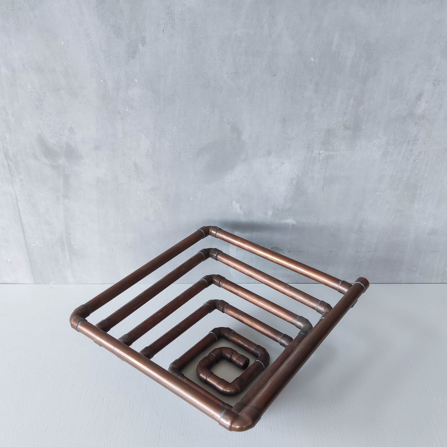 Artisan made sculptural spiral fruit bowl welded patinated copper pipe