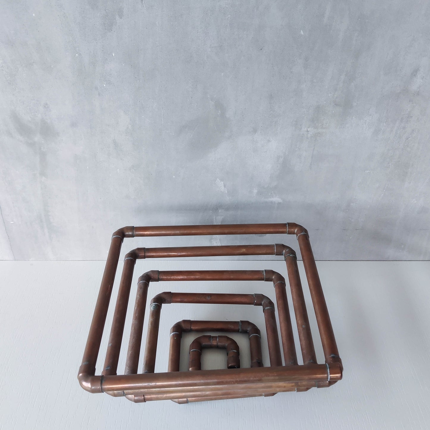 Artisan made sculptural spiral fruit bowl welded patinated copper pipe