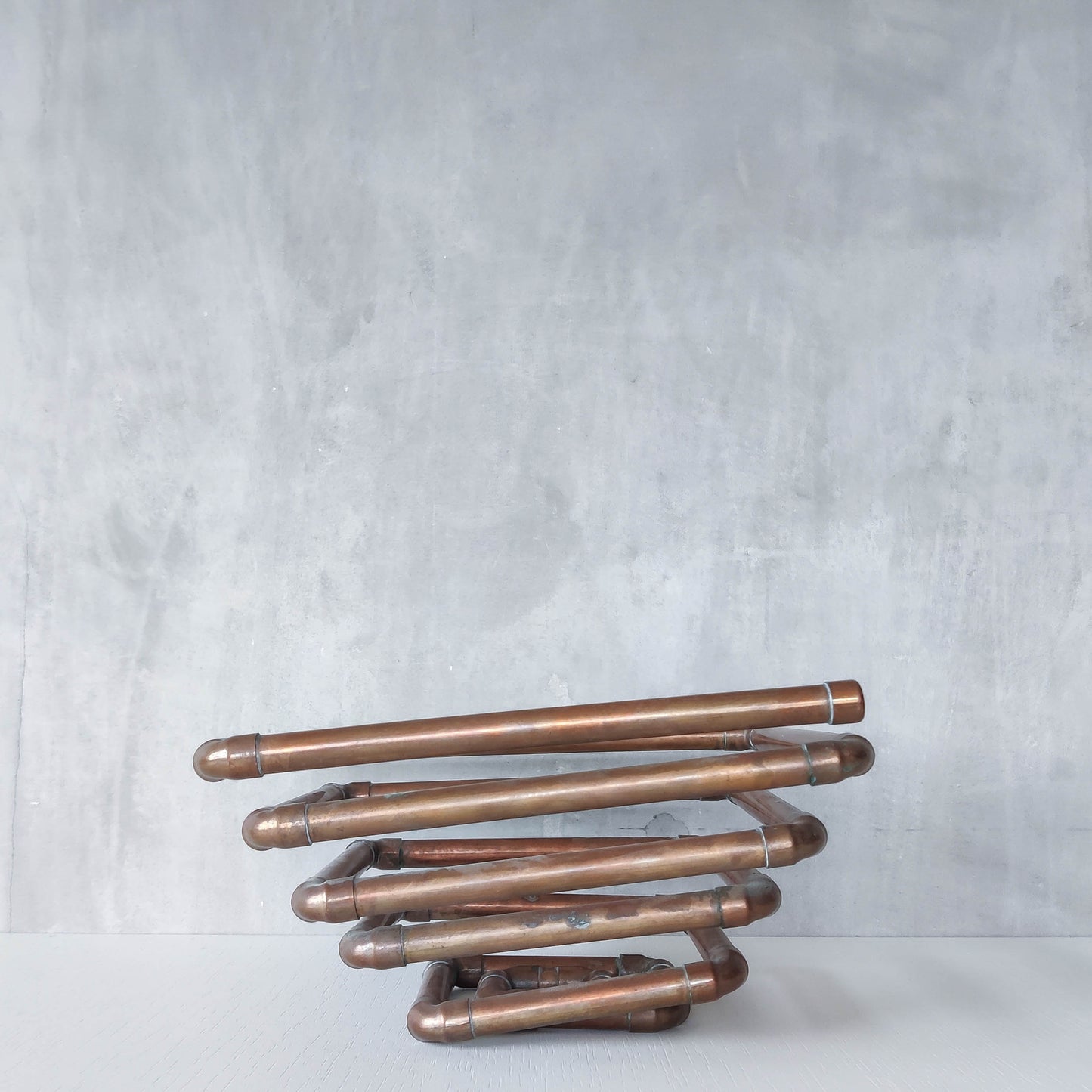 Artisan made sculptural spiral fruit bowl welded patinated copper pipe