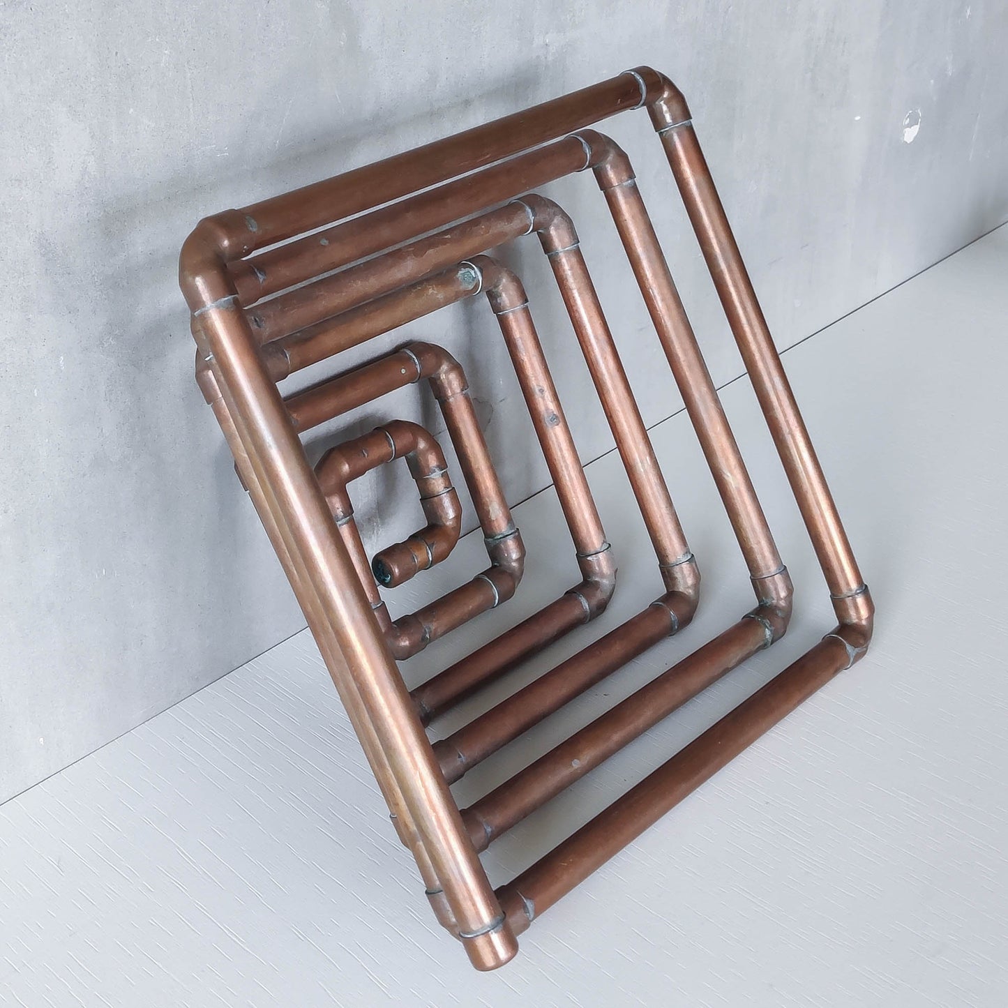 Artisan made sculptural spiral fruit bowl welded patinated copper pipe