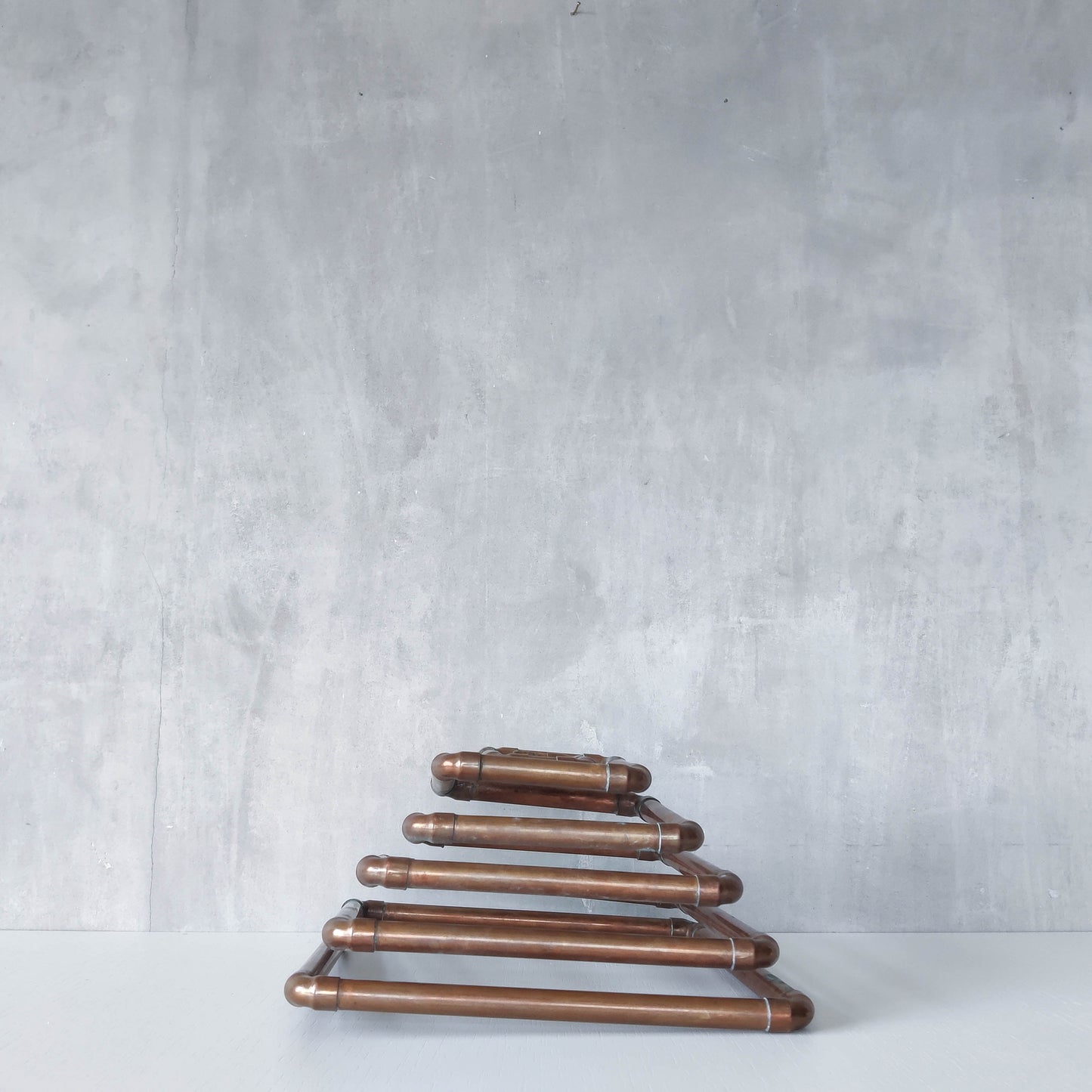 Artisan made sculptural spiral fruit bowl welded patinated copper pipe