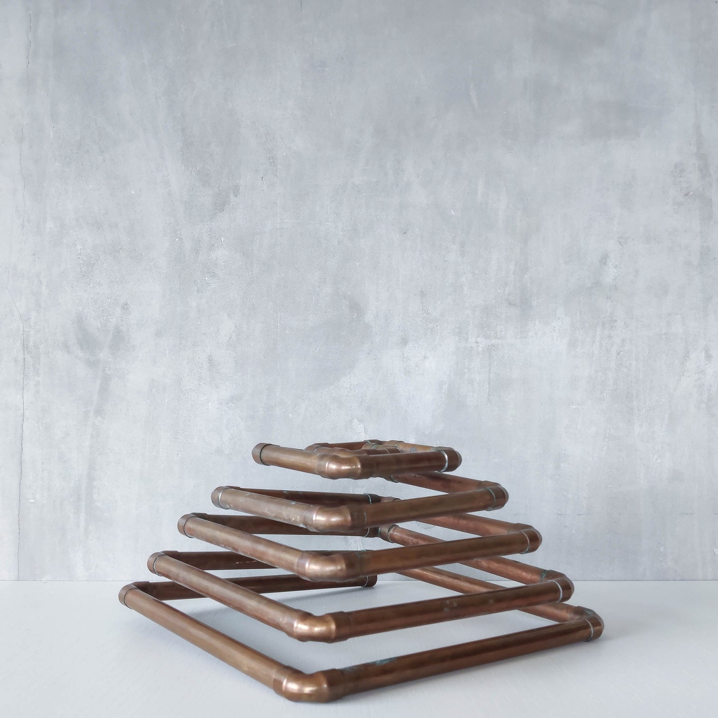 Artisan made sculptural spiral fruit bowl welded patinated copper pipe