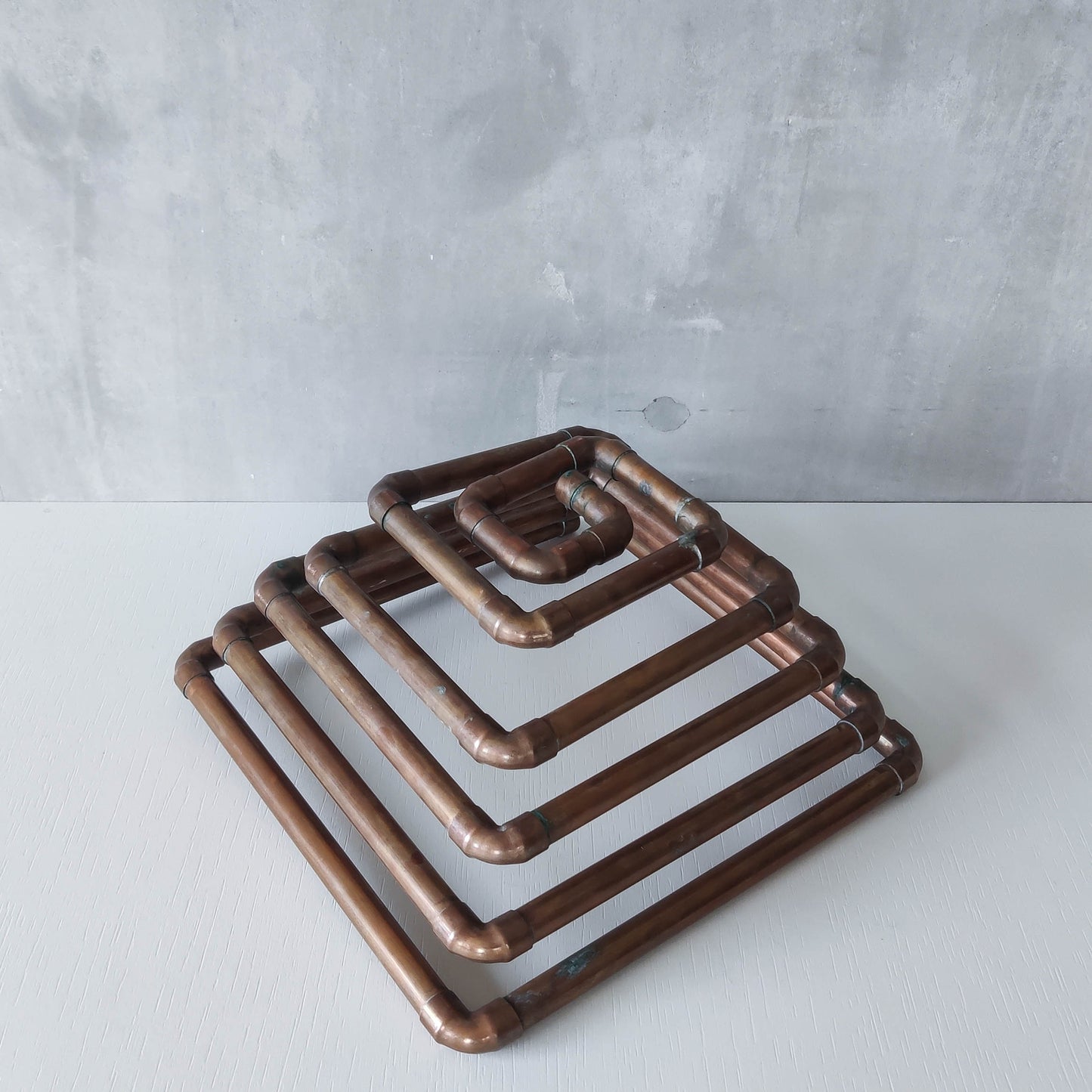 Artisan made sculptural spiral fruit bowl welded patinated copper pipe