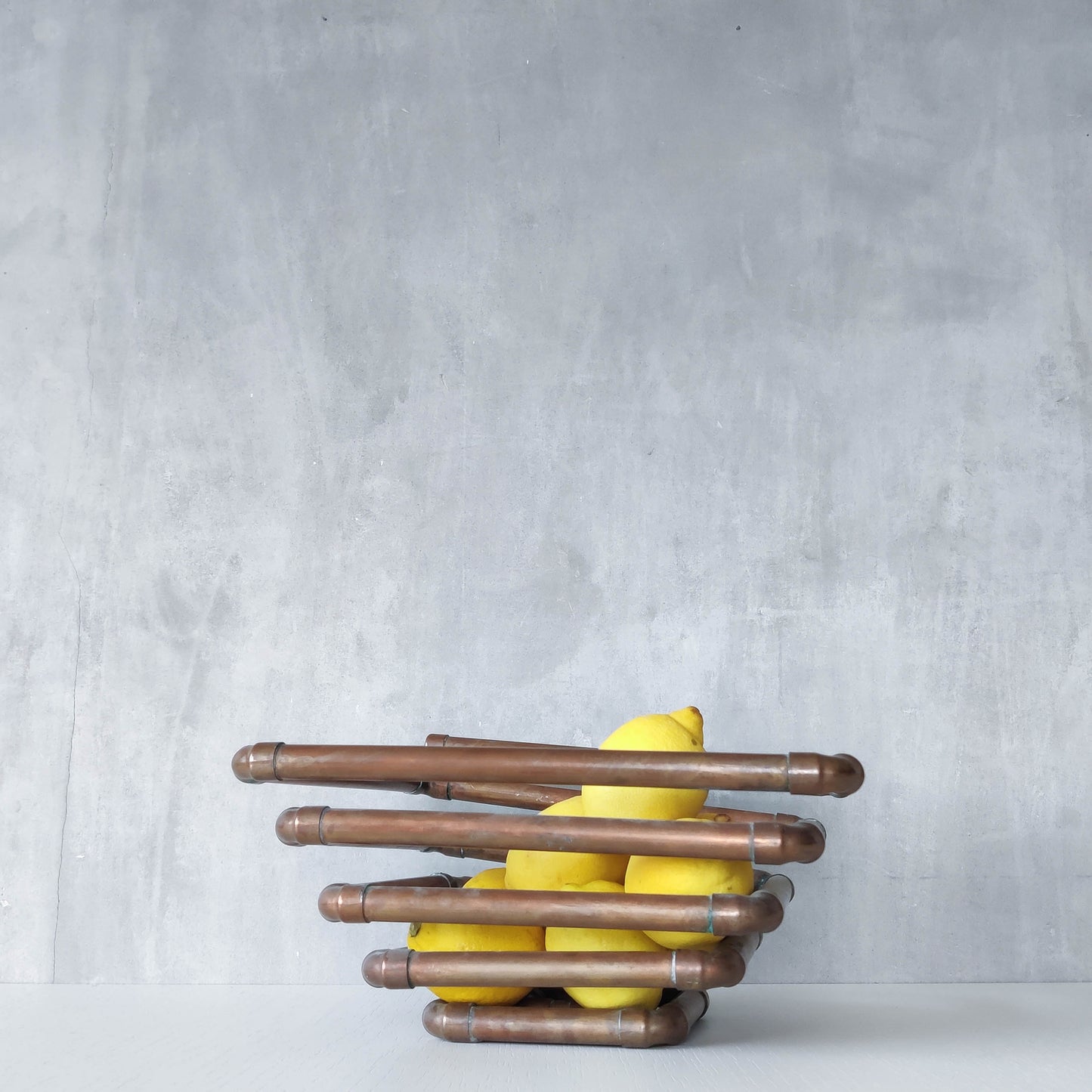 Artisan made sculptural spiral fruit bowl welded patinated copper pipe