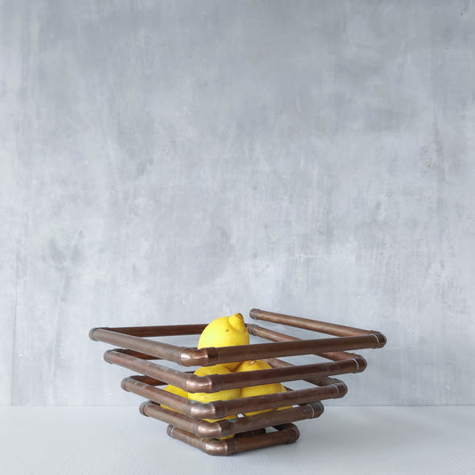 Artisan made sculptural spiral fruit bowl welded patinated copper pipe