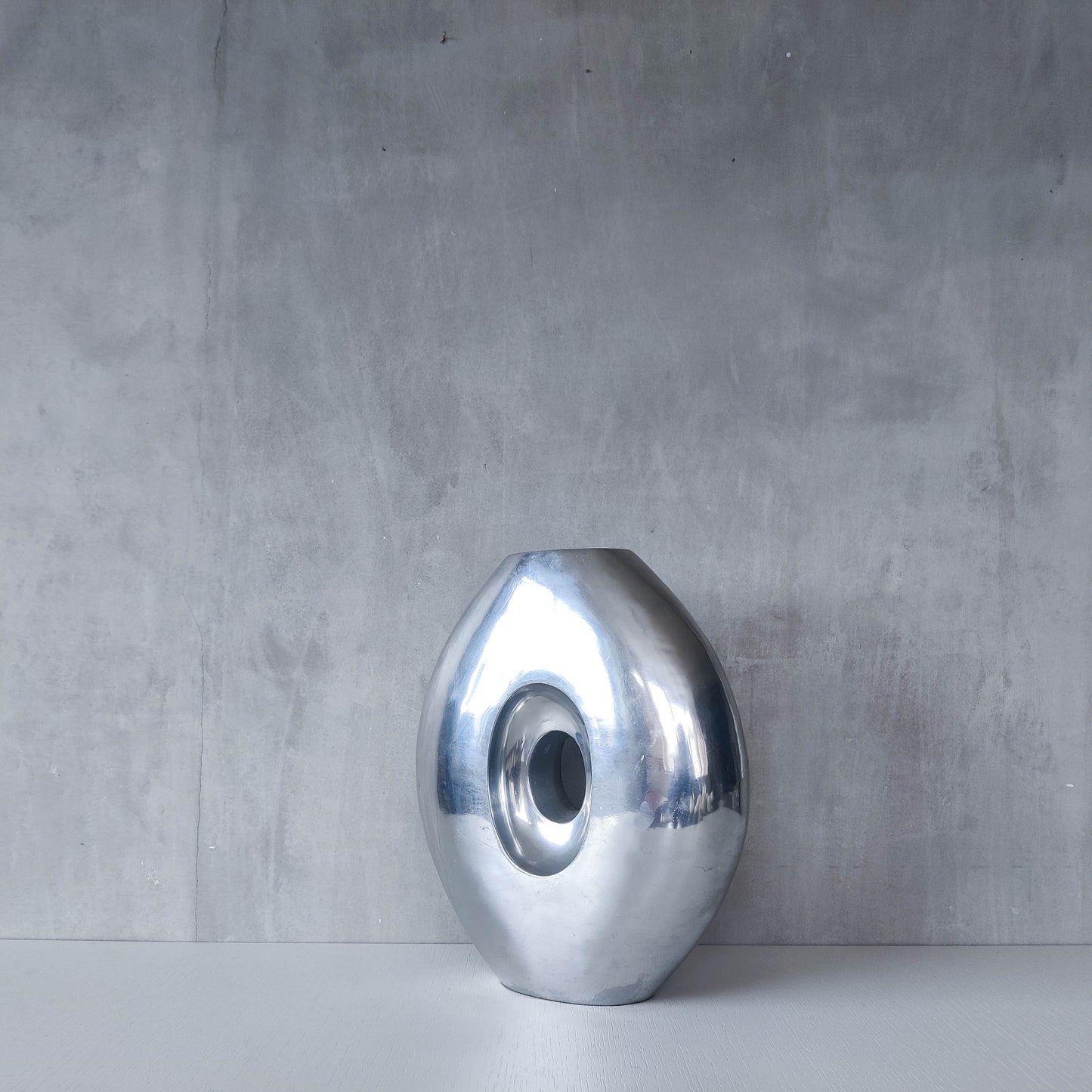 Vintage large sculptural modernist hand cast aluminium oval donut vase