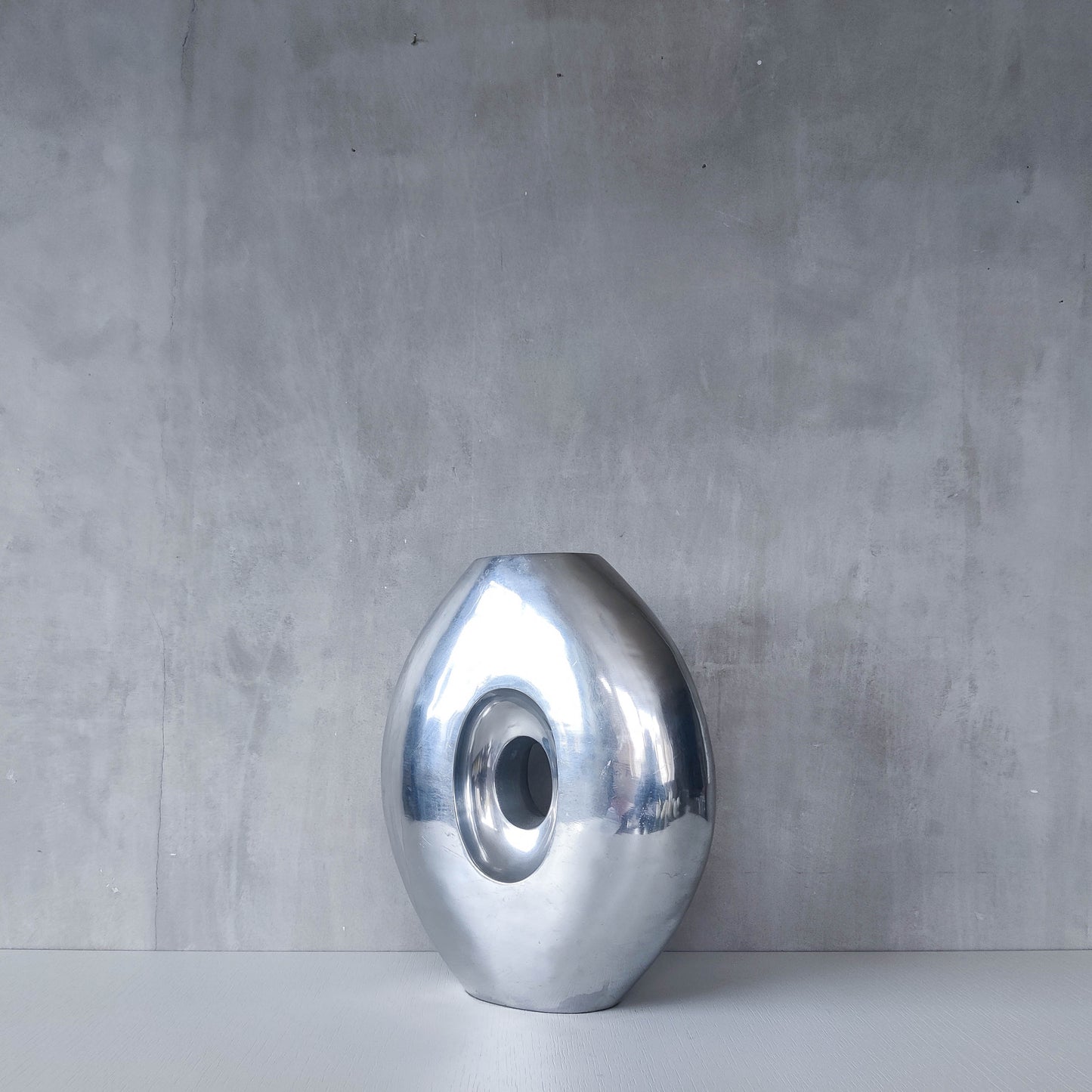 Vintage large sculptural modernist hand cast aluminium oval donut vase