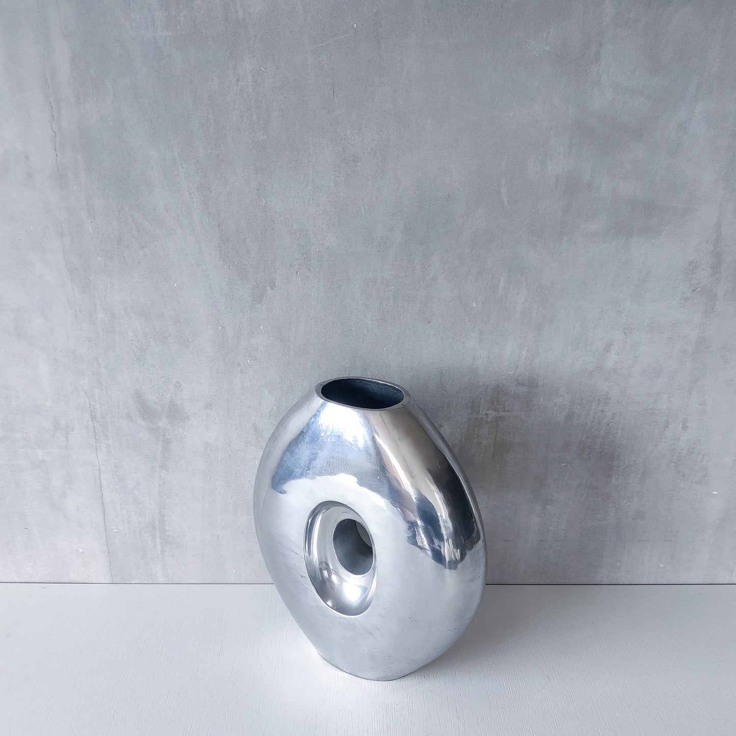 Vintage large sculptural modernist hand cast aluminium oval donut vase