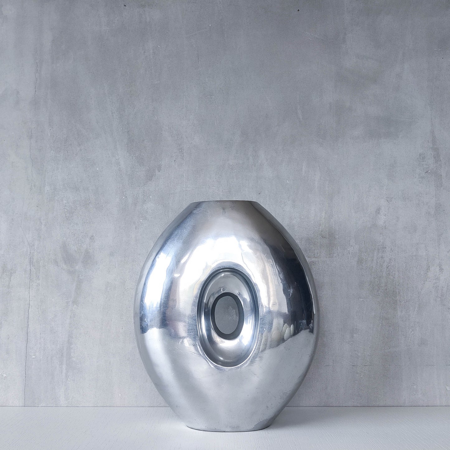 Vintage large sculptural modernist hand cast aluminium oval donut vase