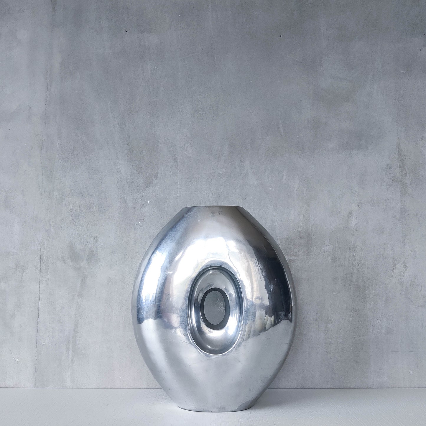 Vintage large sculptural modernist hand cast aluminium oval donut vase