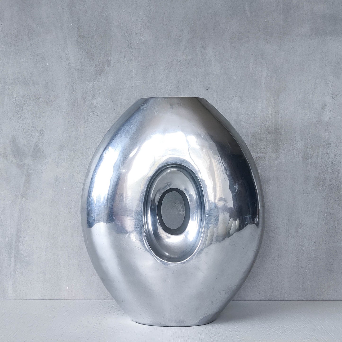 Vintage large sculptural modernist hand cast aluminium oval donut vase