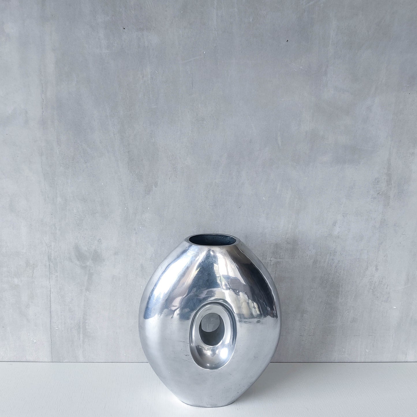 Vintage large sculptural modernist hand cast aluminium oval donut vase