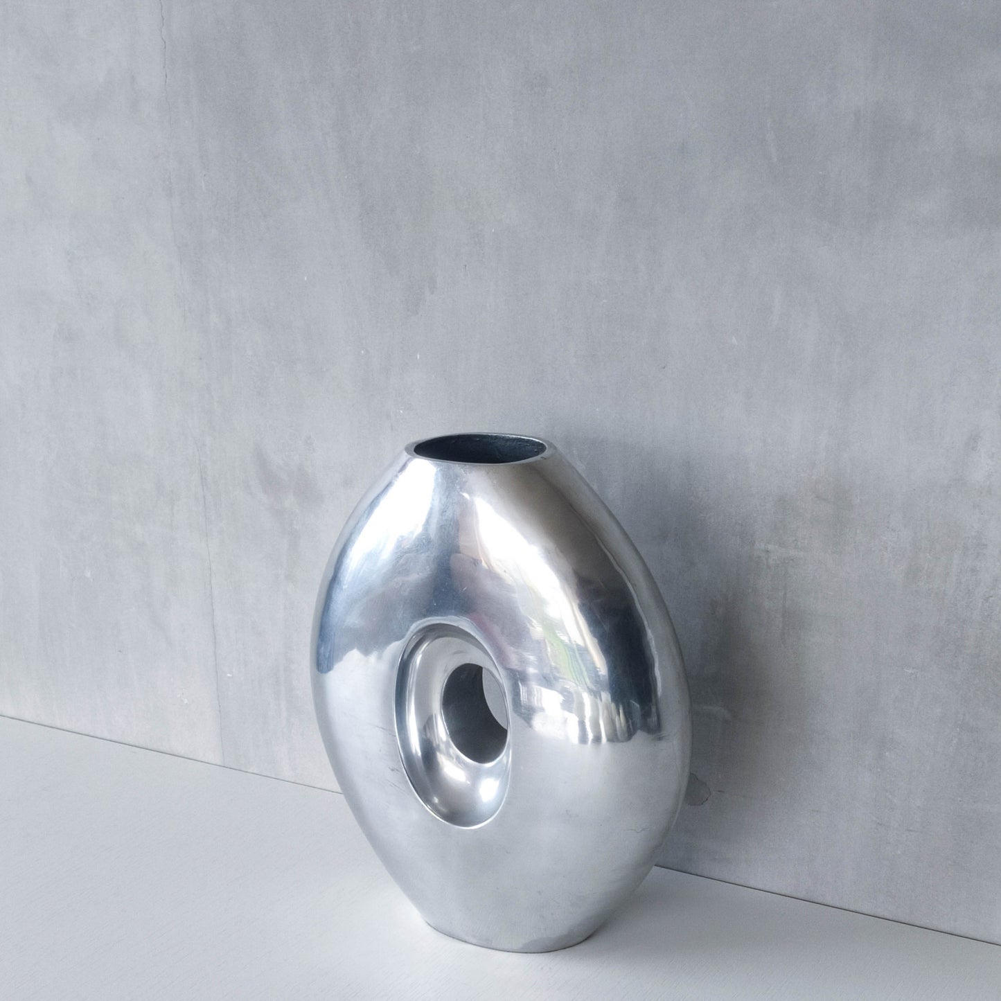 Vintage large sculptural modernist hand cast aluminium oval donut vase