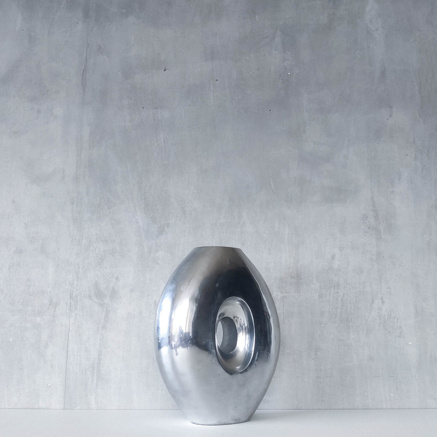 Vintage large sculptural modernist hand cast aluminium oval donut vase