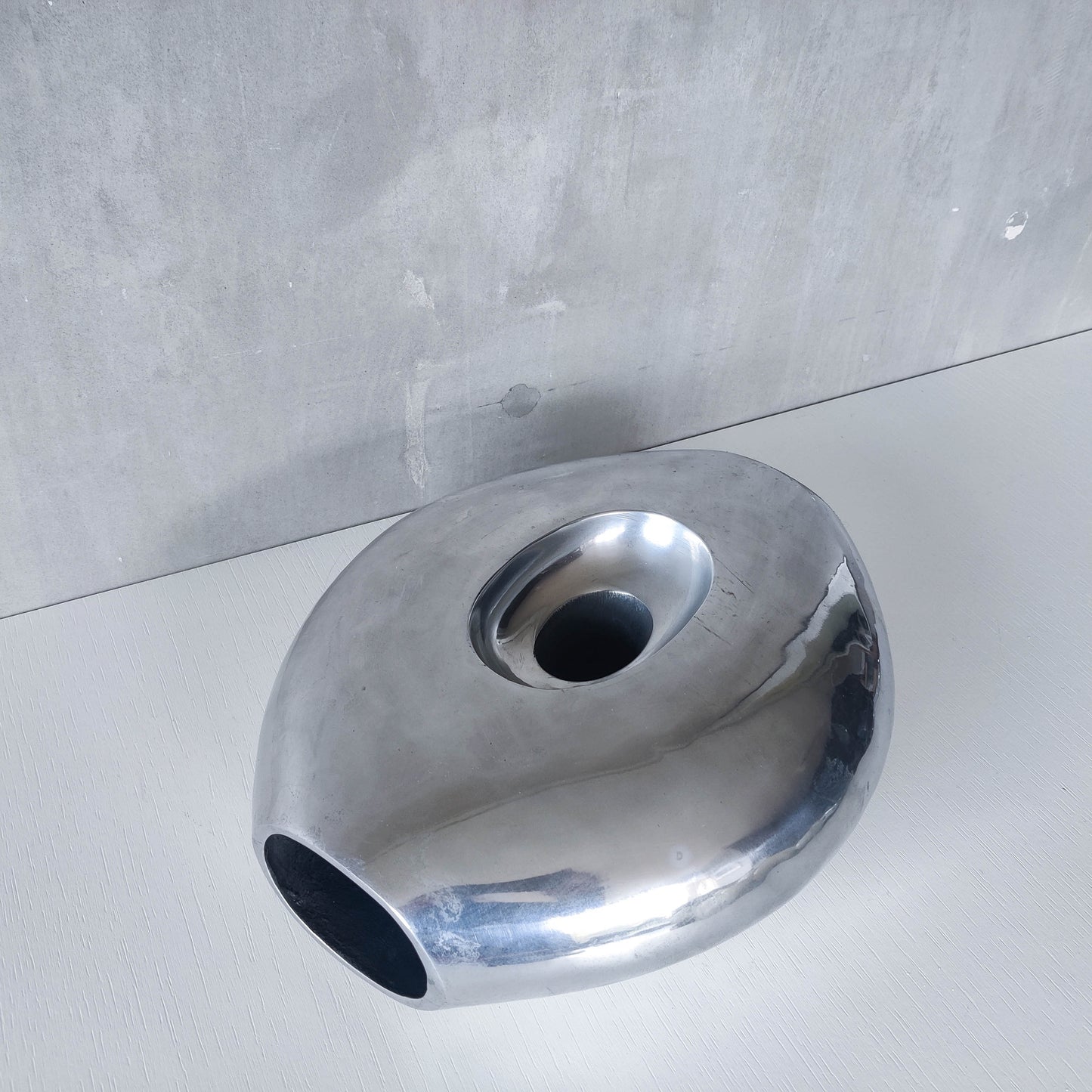 Vintage large sculptural modernist hand cast aluminium oval donut vase