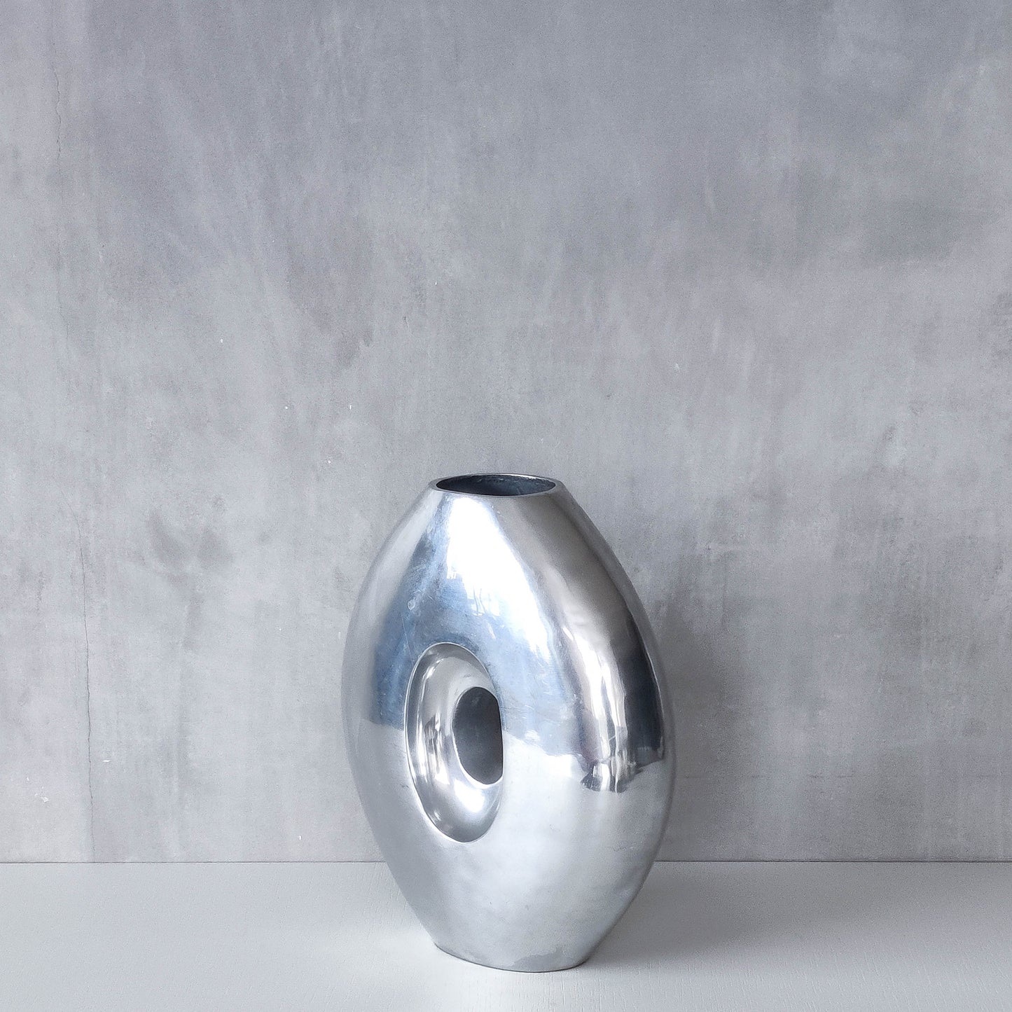 Vintage large sculptural modernist hand cast aluminium oval donut vase