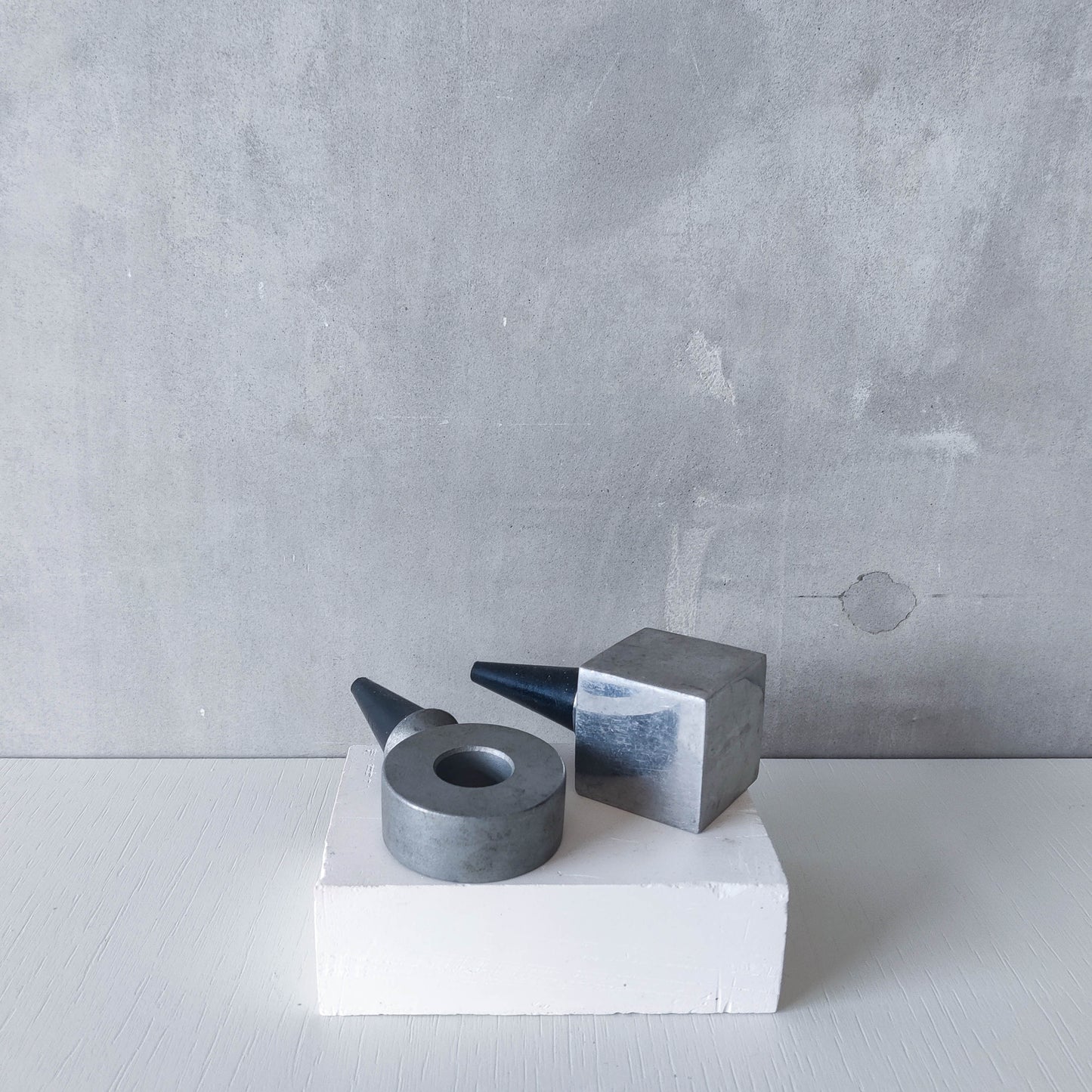 Pair of vintage cast aluminium wine bottle stoppers tops modernist geometric form