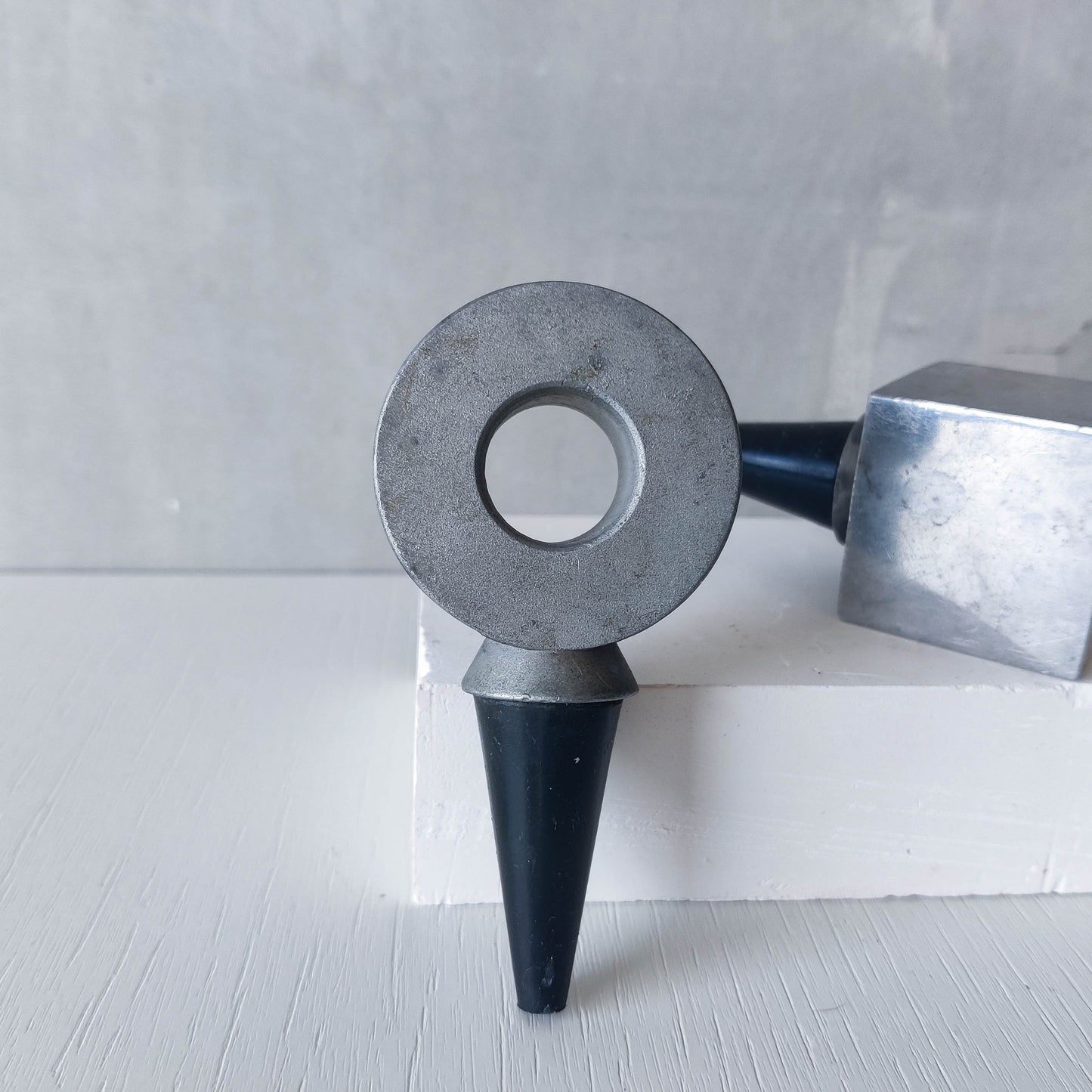 Pair of vintage cast aluminium wine bottle stoppers tops modernist geometric form