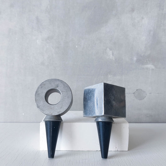 Pair of vintage cast aluminium wine bottle stoppers tops modernist geometric form