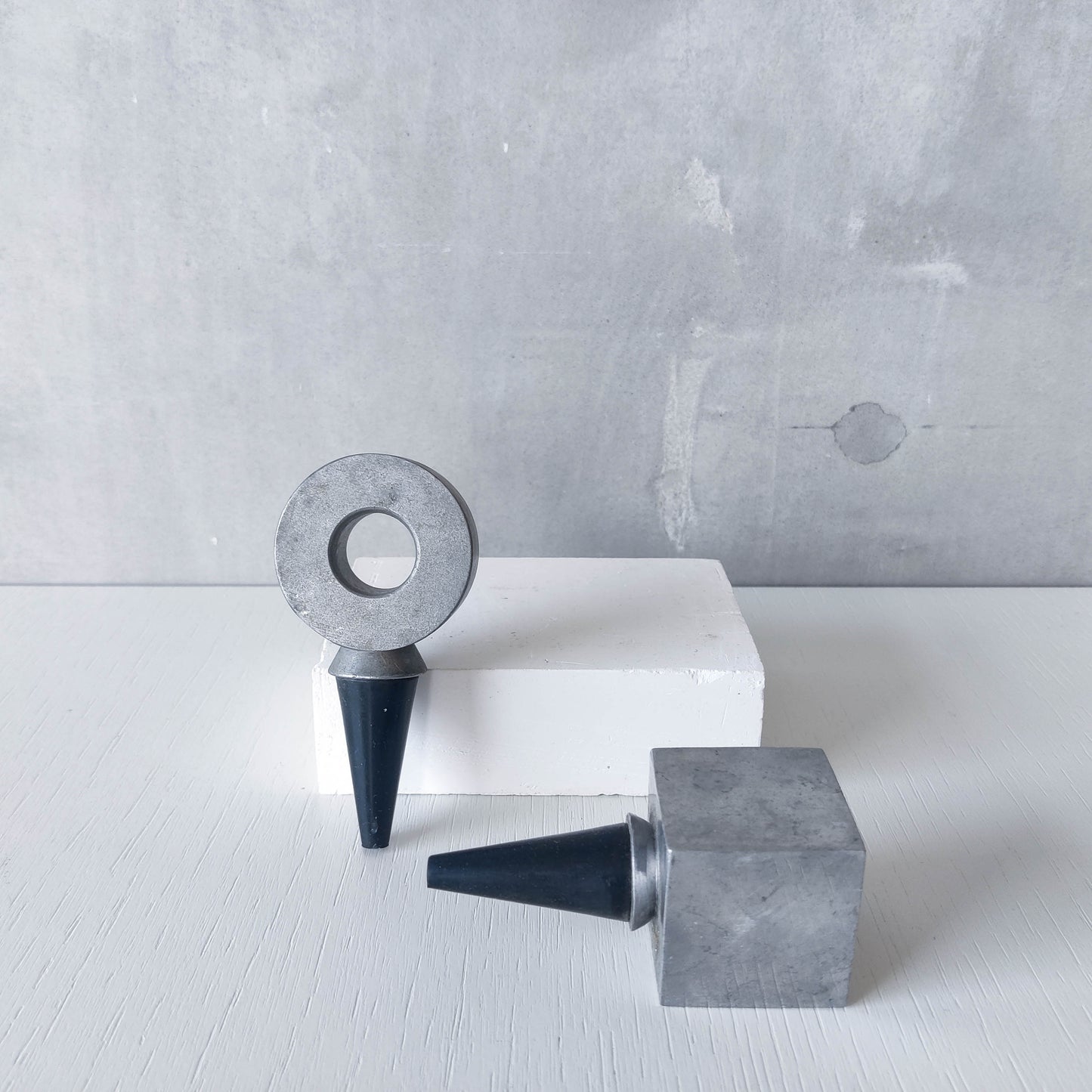 Pair of vintage cast aluminium wine bottle stoppers tops modernist geometric form