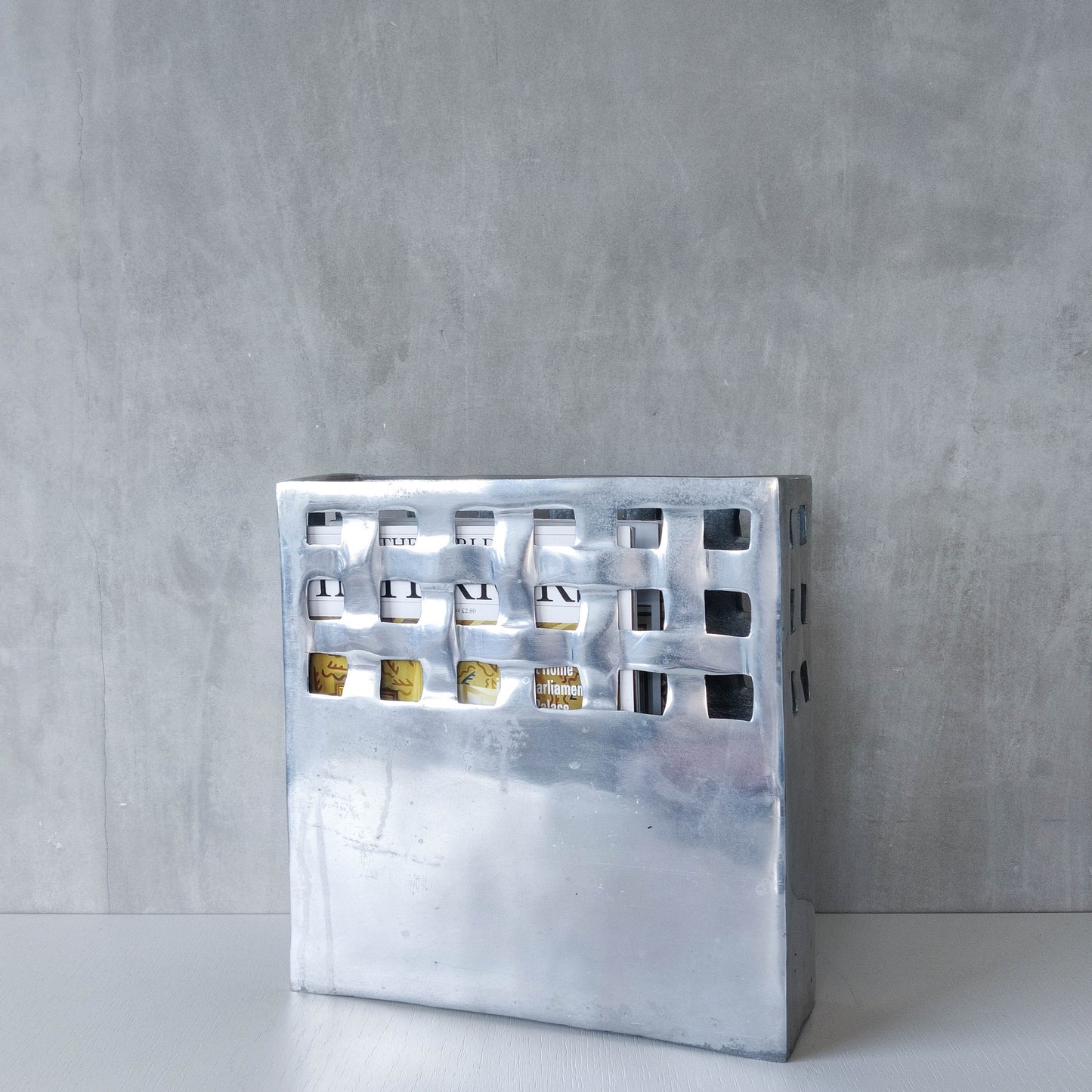 Vintage 00s hand cast aluminium lattice basket weave magazine rack holder