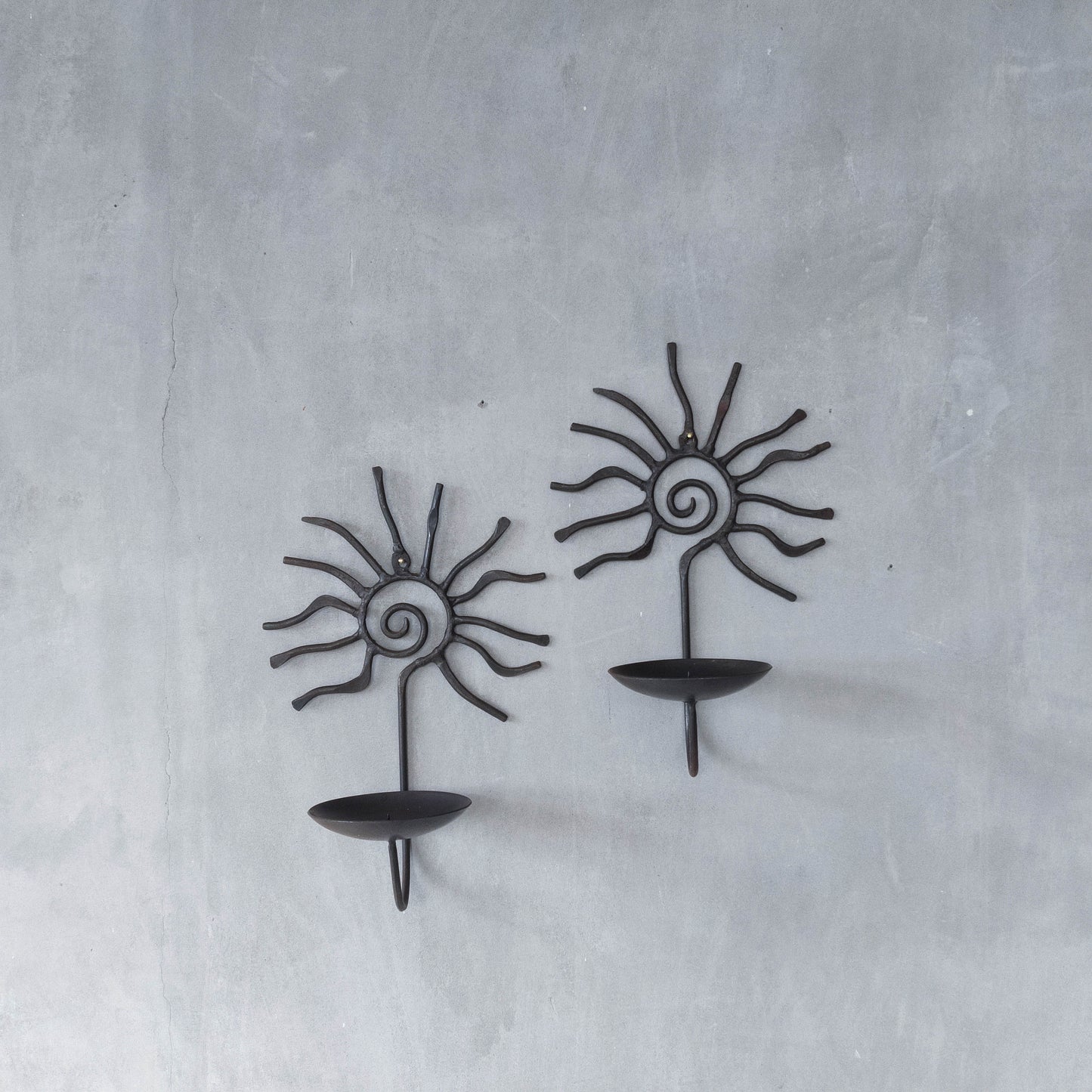 Pair of vintage 90s welded steel sun ray spiral swirl candle wall sconces