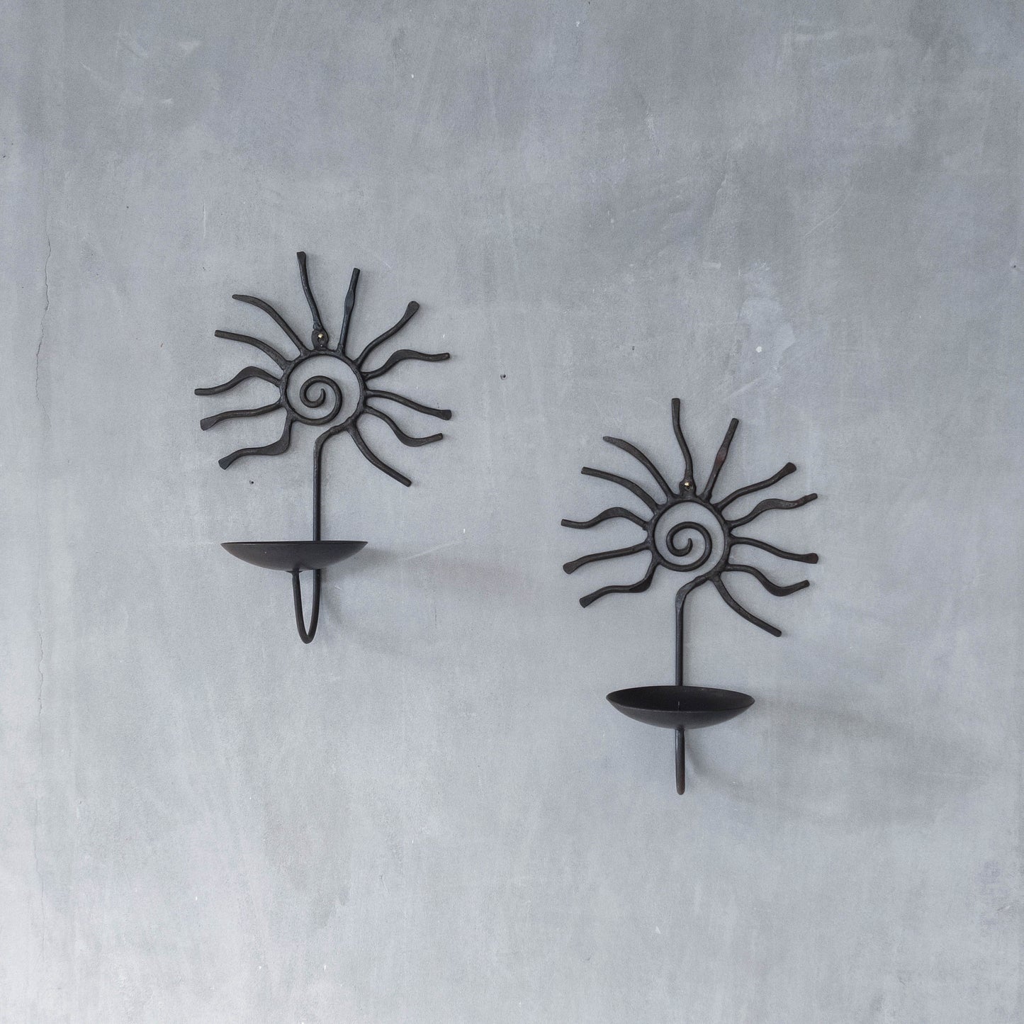 Pair of vintage 90s welded steel sun ray spiral swirl candle wall sconces