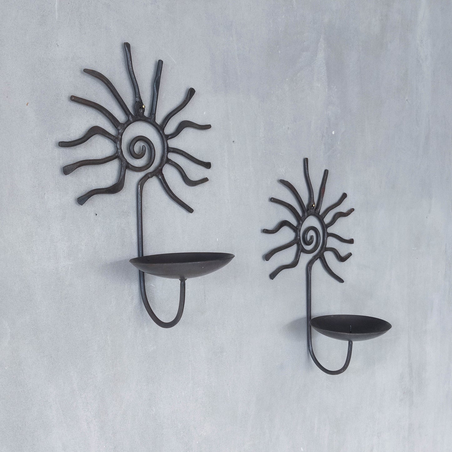Pair of vintage 90s welded steel sun ray spiral swirl candle wall sconces