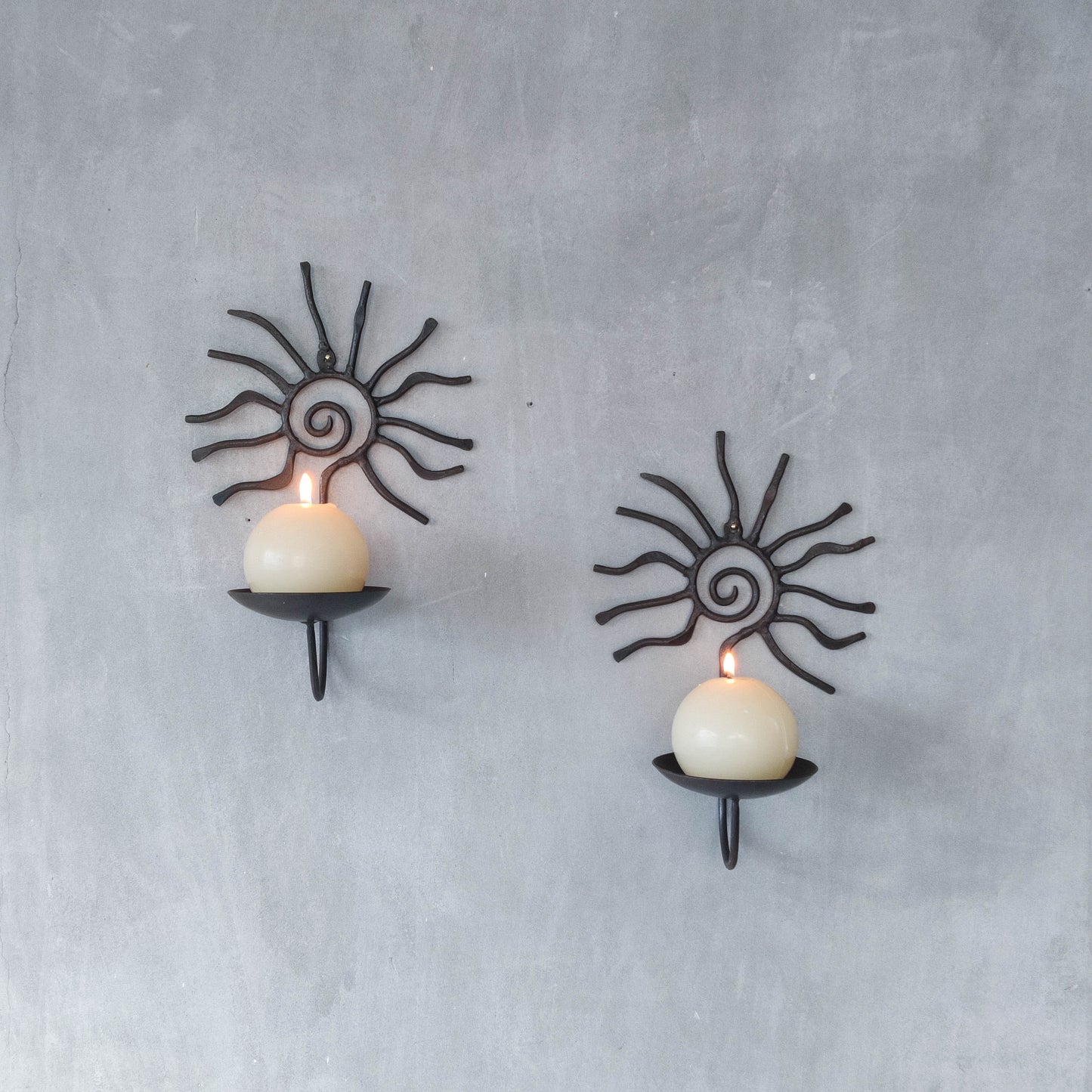 Pair of vintage 90s welded steel sun ray spiral swirl candle wall sconces