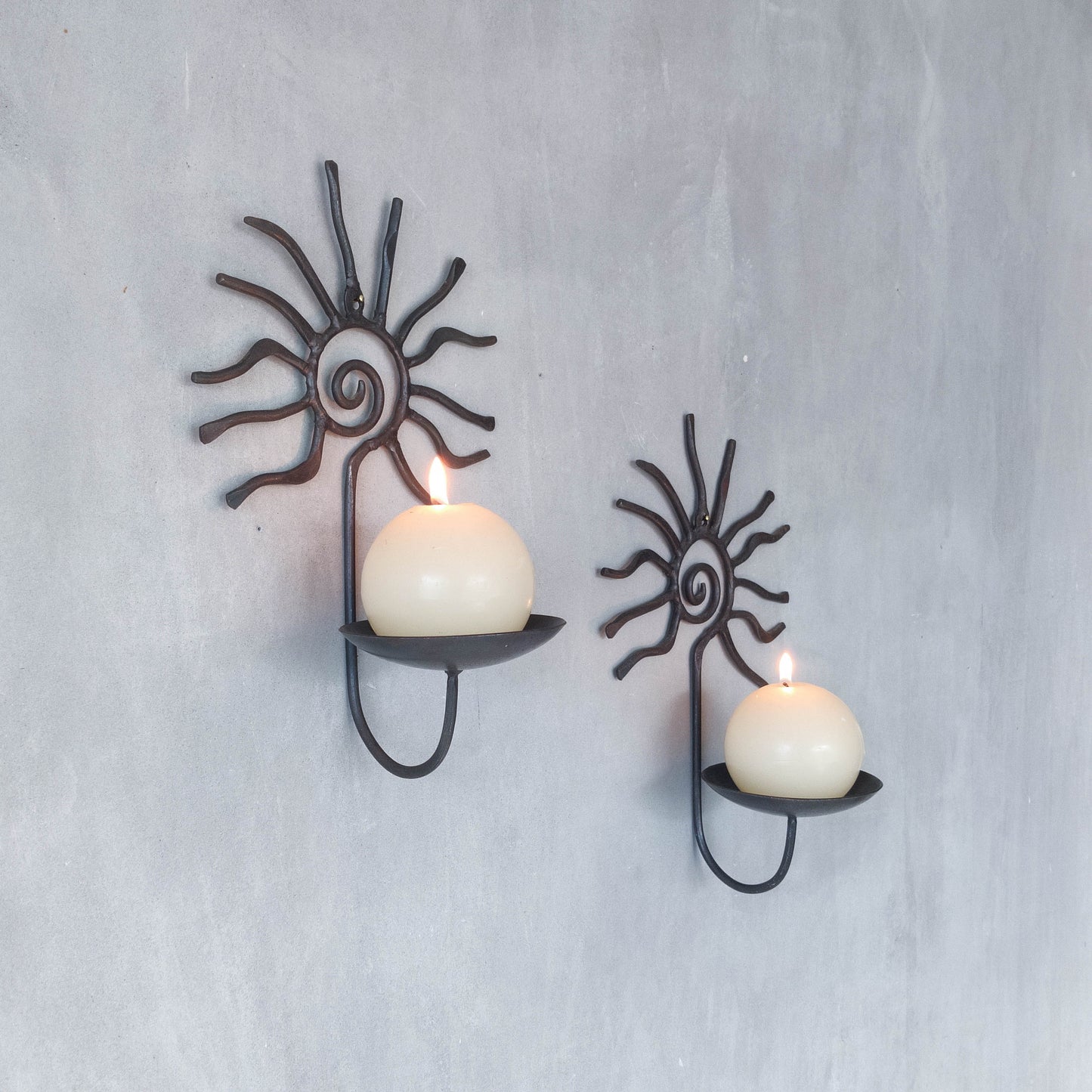 Pair of vintage 90s welded steel sun ray spiral swirl candle wall sconces