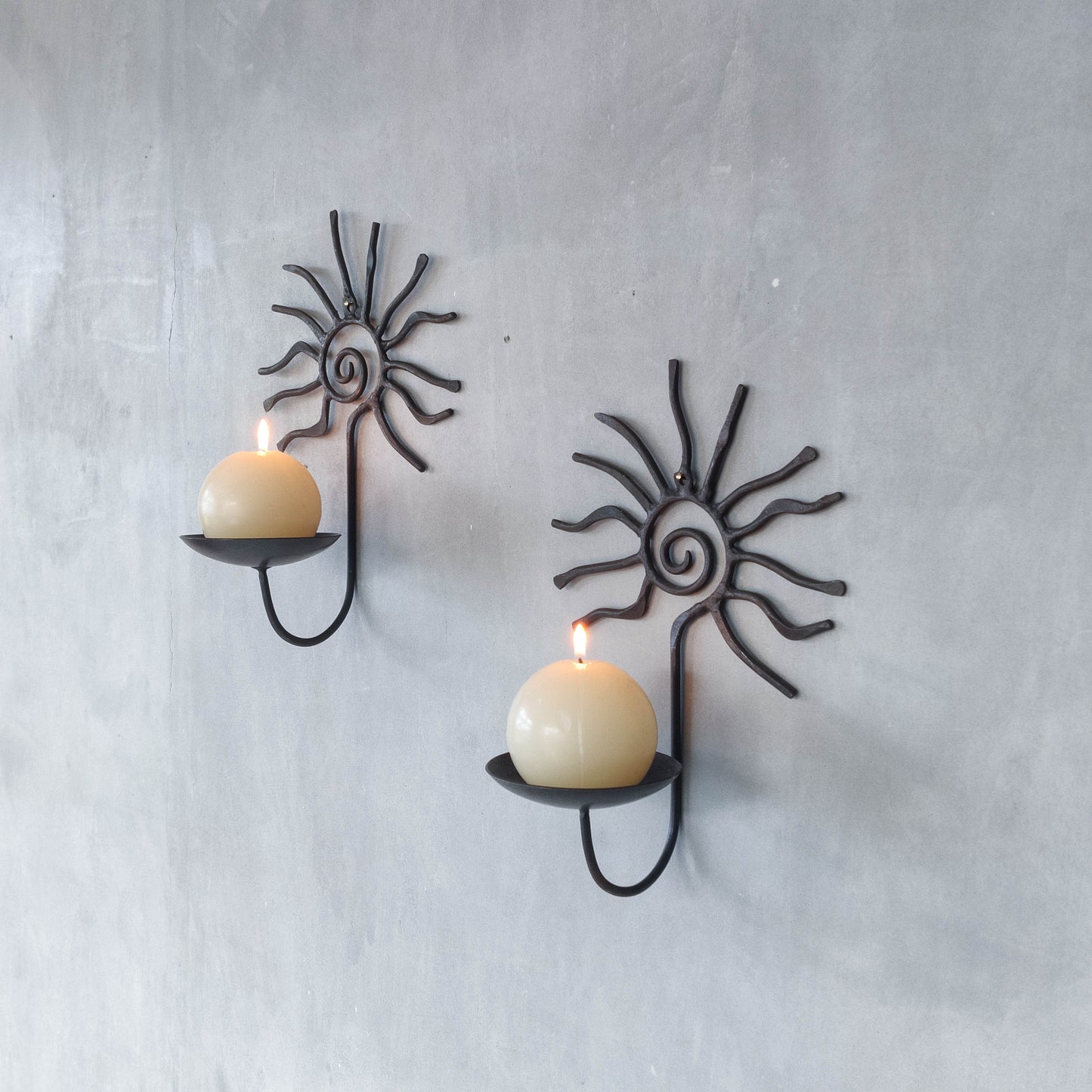 Pair of vintage 90s welded steel sun ray spiral swirl candle wall sconces