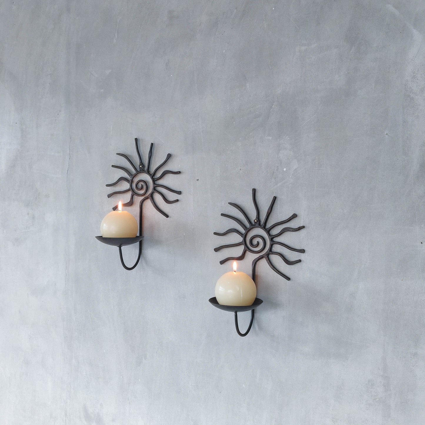 Pair of vintage 90s welded steel sun ray spiral swirl candle wall sconces