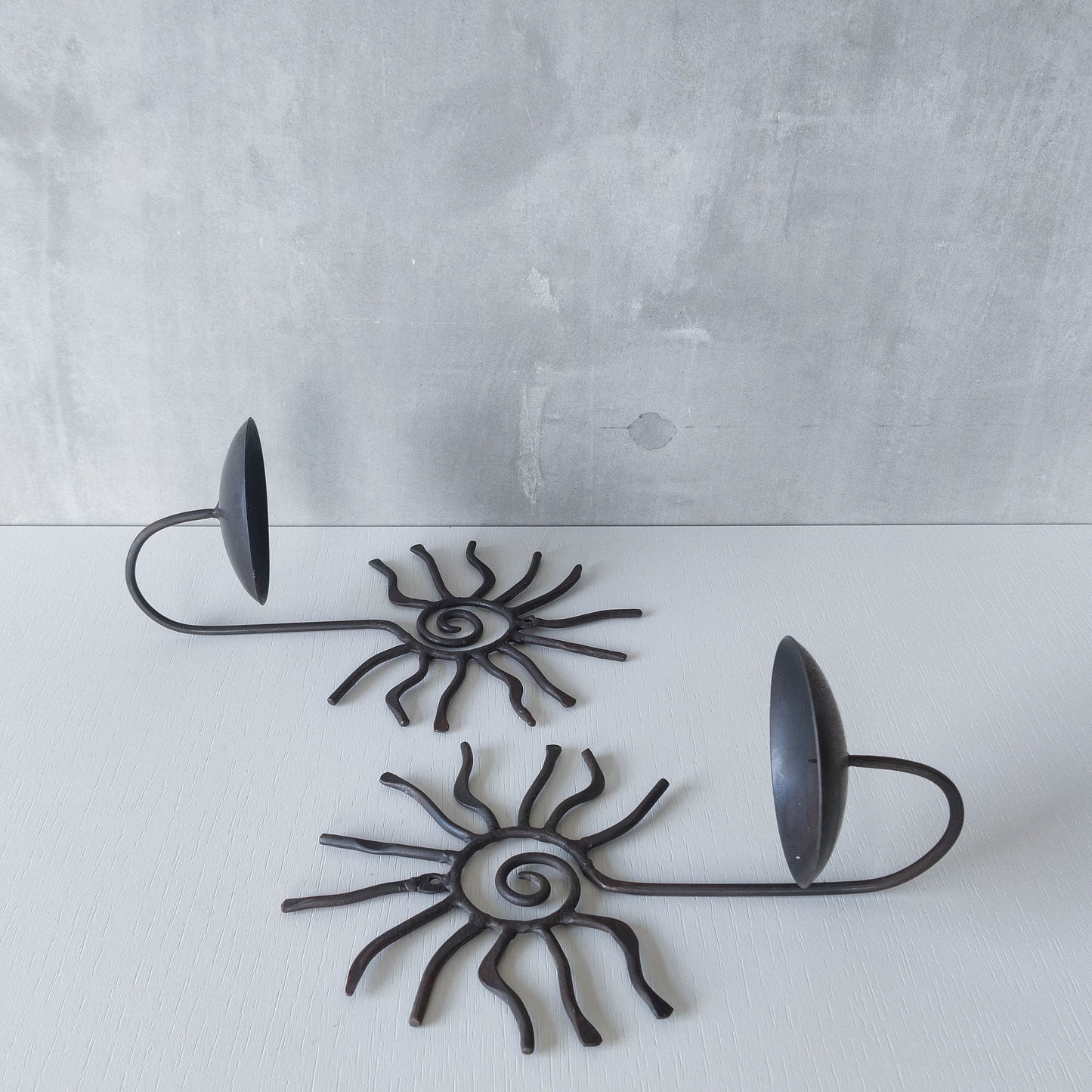 Pair of vintage 90s welded steel sun ray spiral swirl candle wall sconces
