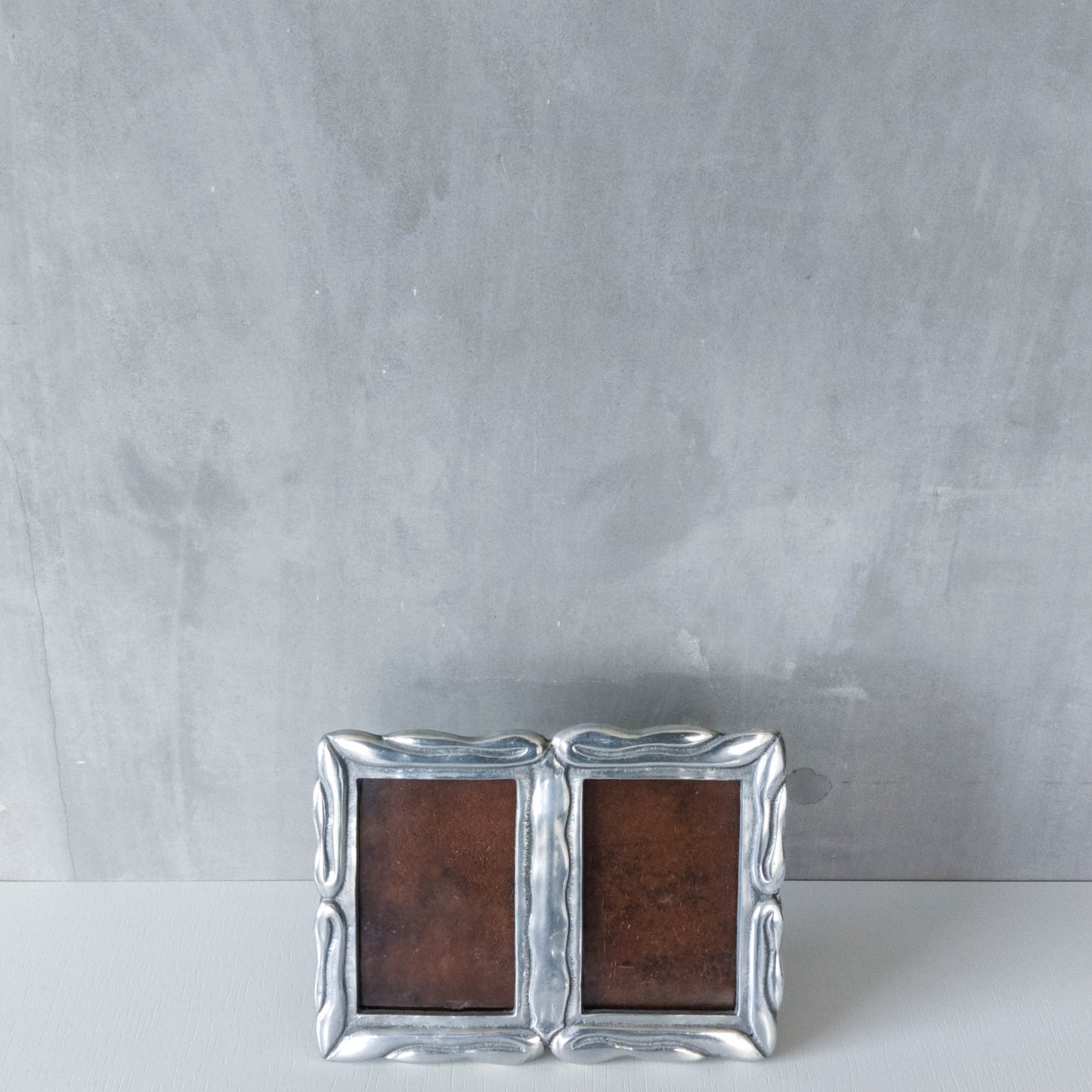 Vintage 1990s cast aluminium organic modernist form double picture photo frame