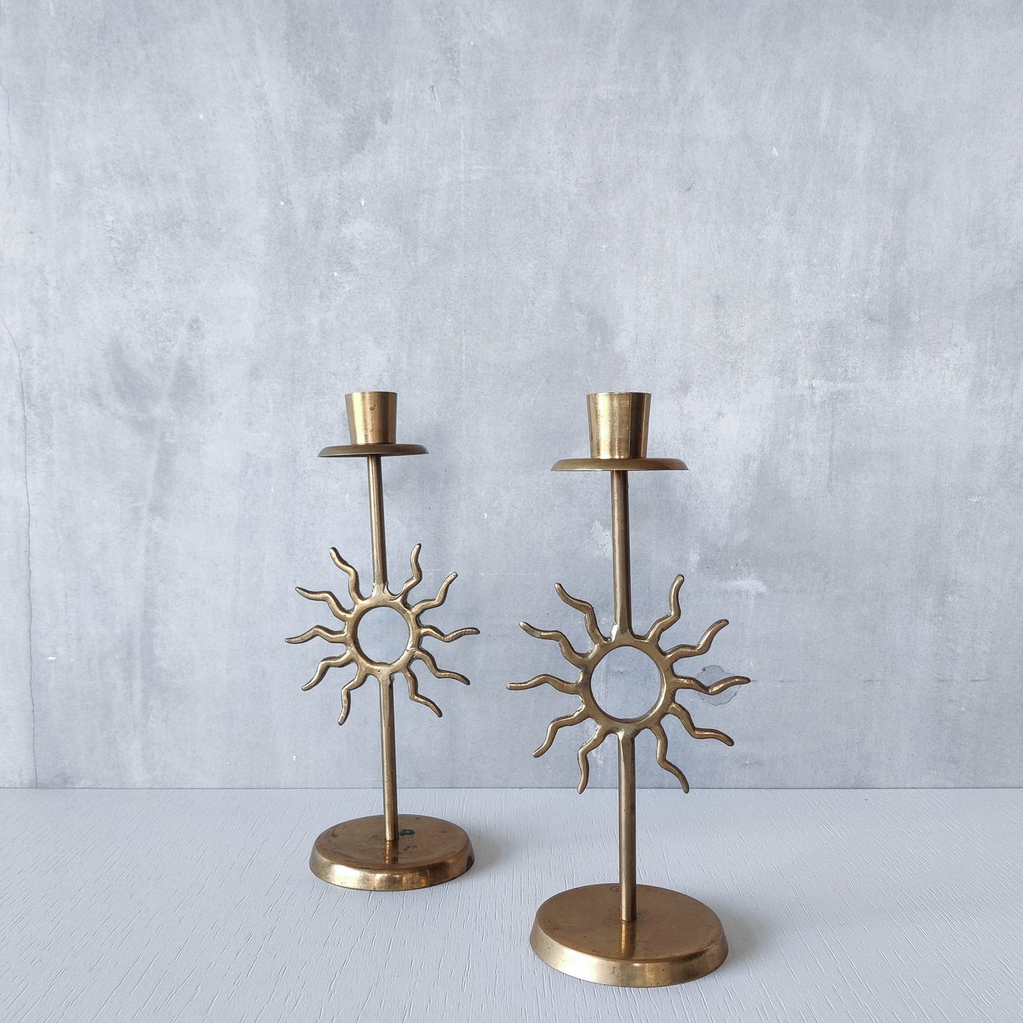 Vintage 1990s pair of cast brass Fornasetti style sun celestial candle holders