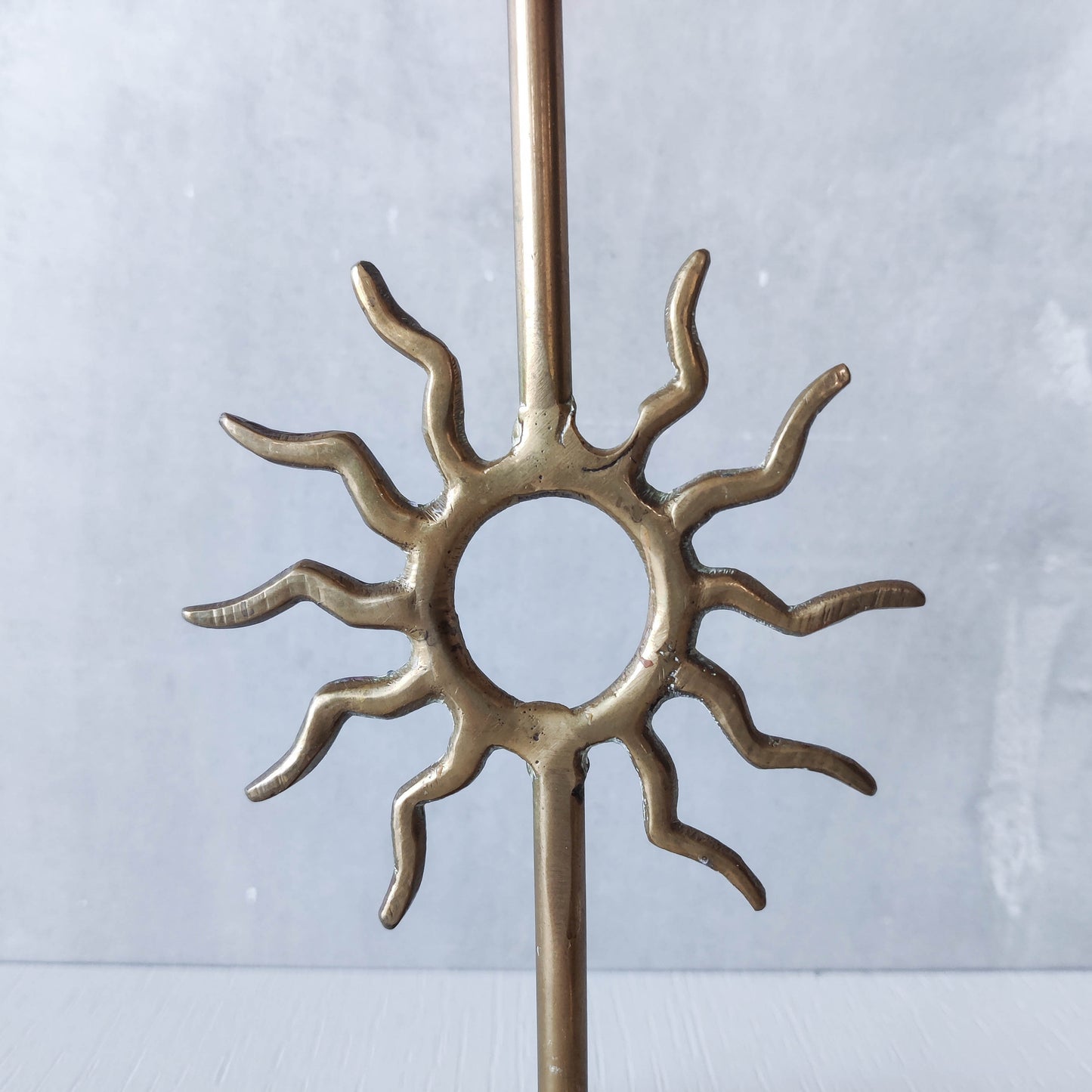 Vintage 1990s pair of cast brass Fornasetti style sun celestial candle holders