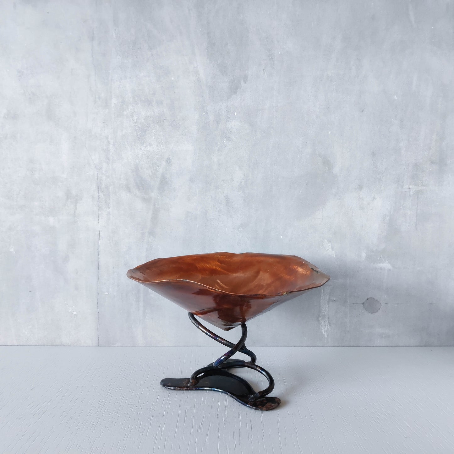 Artisan made copper metalwork conical footed bowl with twisted steel base signed
