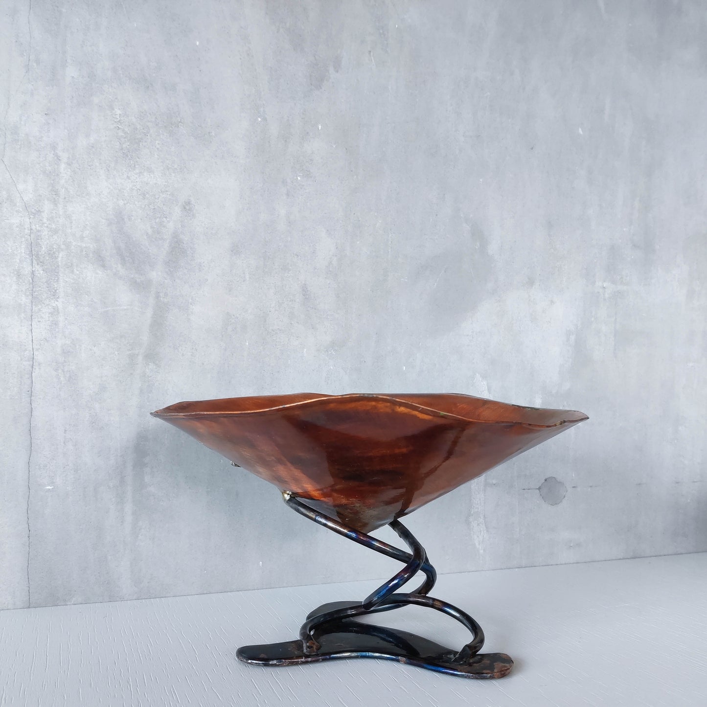 Artisan made copper metalwork conical footed bowl with twisted steel base signed