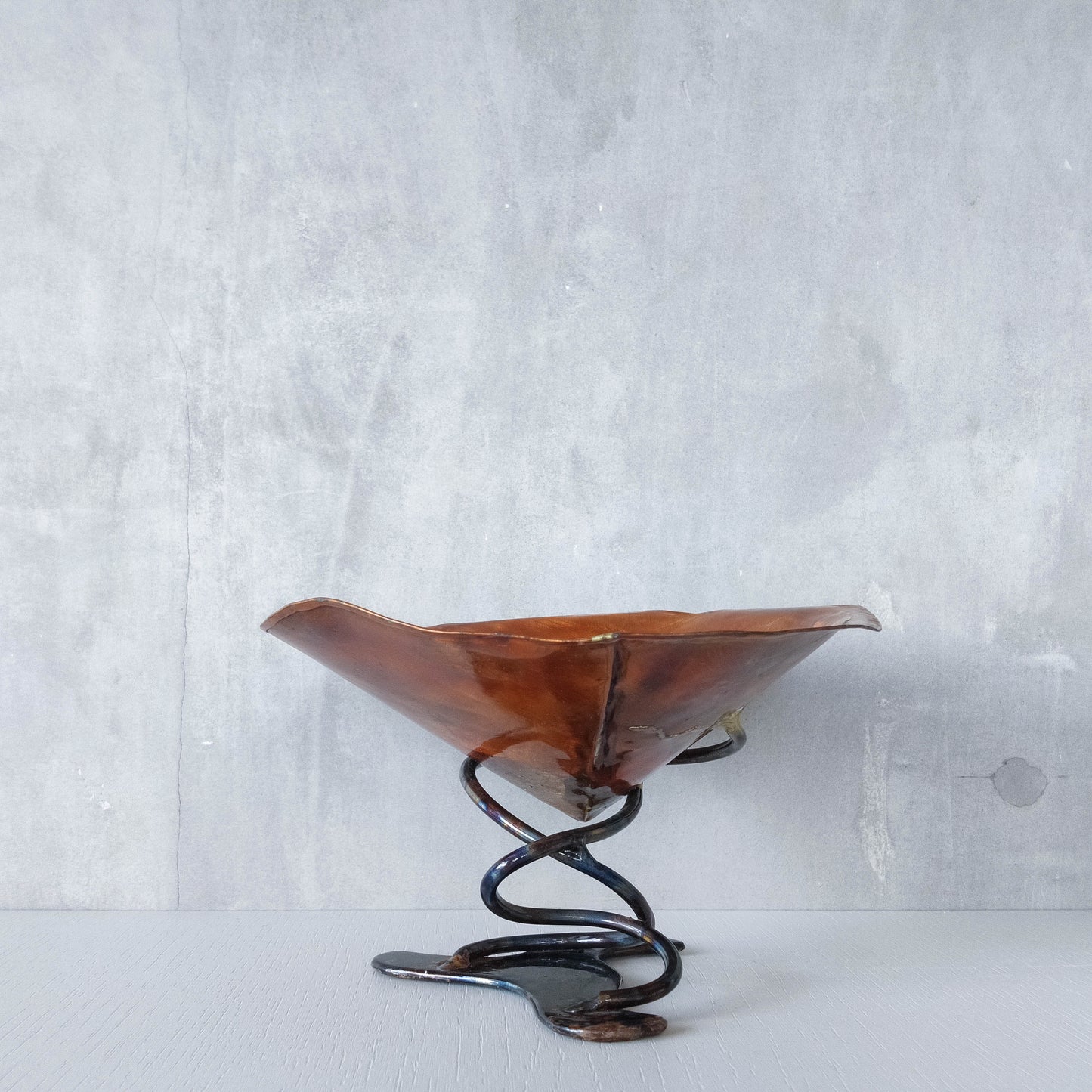 Artisan made copper metalwork conical footed bowl with twisted steel base signed