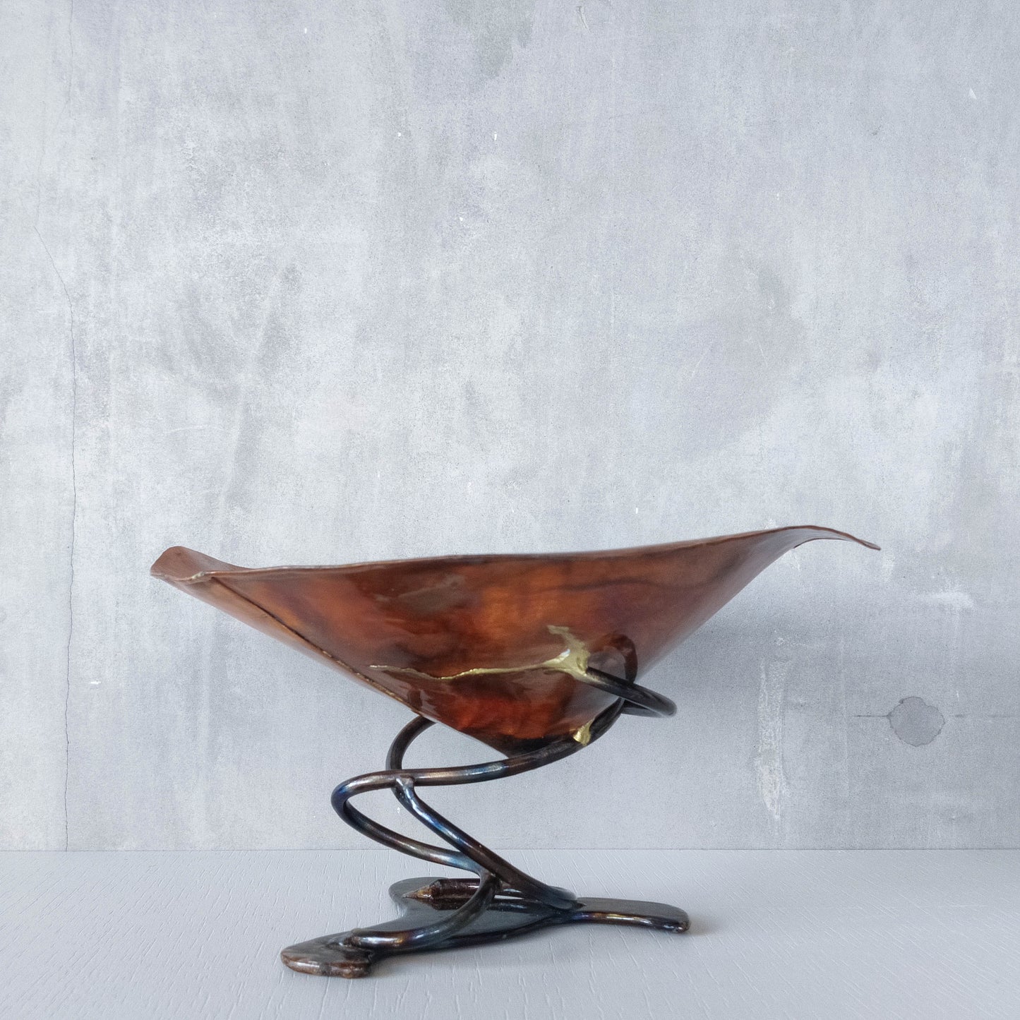 Artisan made copper metalwork conical footed bowl with twisted steel base signed